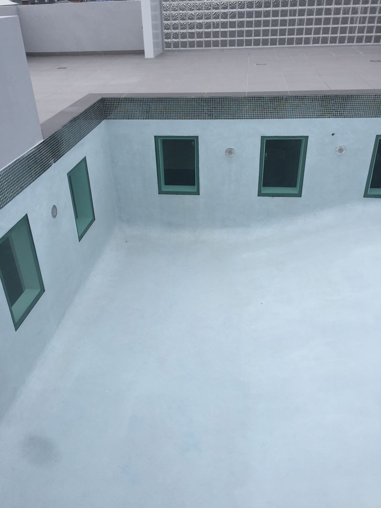 A Swimming Pool With A Lot Of Windows In It — Glass Pool Windows Australia In Old Bar, NSW