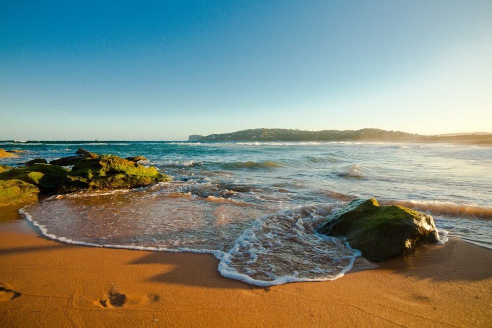 Gentle Waves Lapping Onto a Sandy Shore — Glass Pool Windows Australia In Palm Beach, NSW