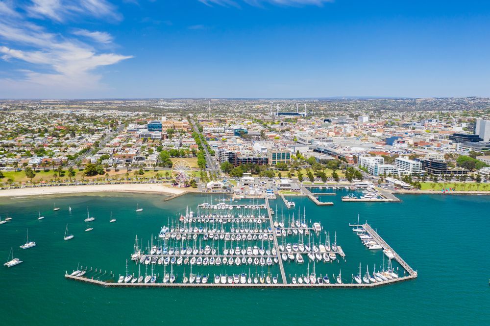 An Aerial View Of A Marina Filled With Boats And A City In The Background — Glass Pool Windows Australia In Geelong, VIC