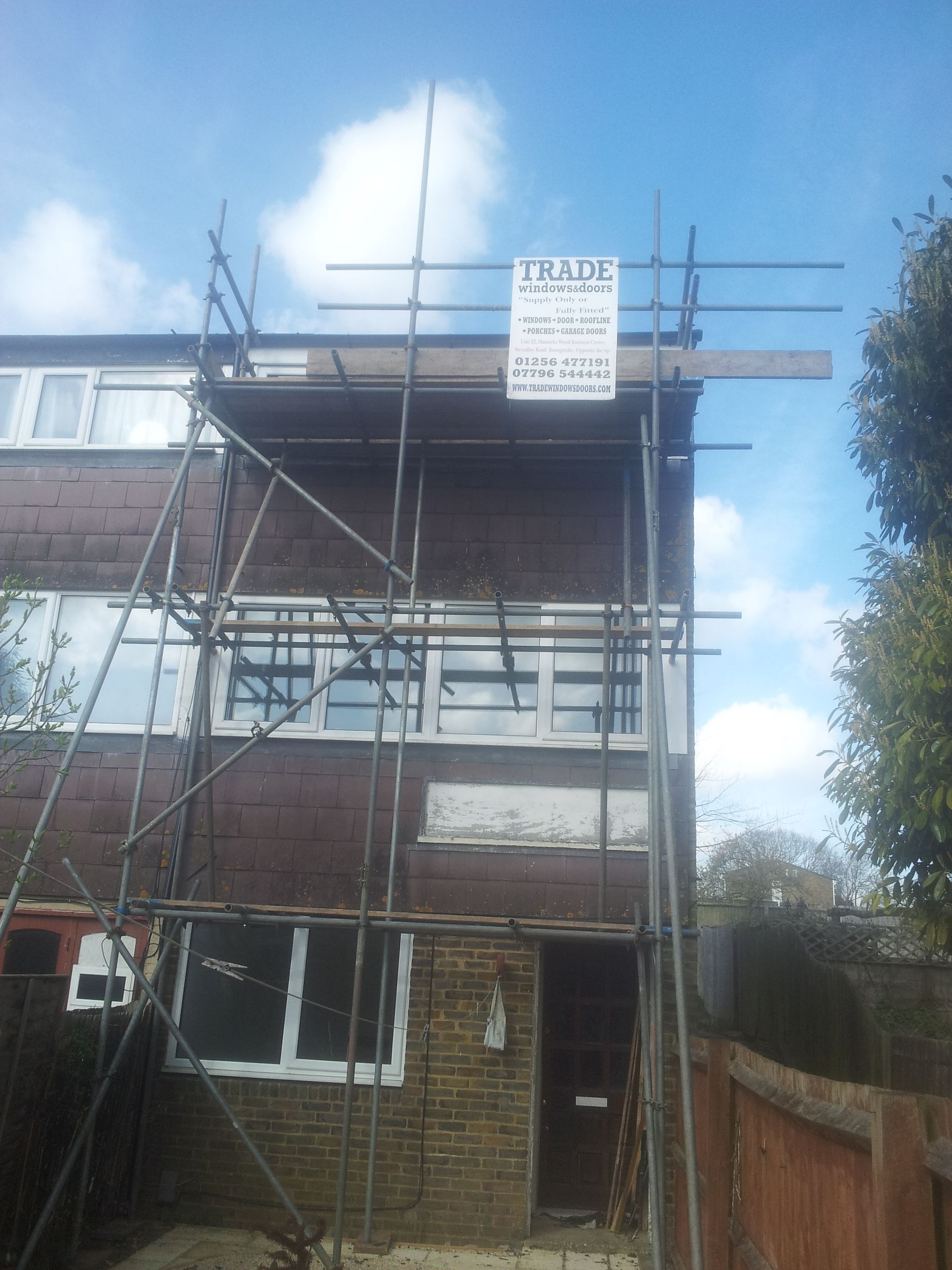 Roofing with scaffolding