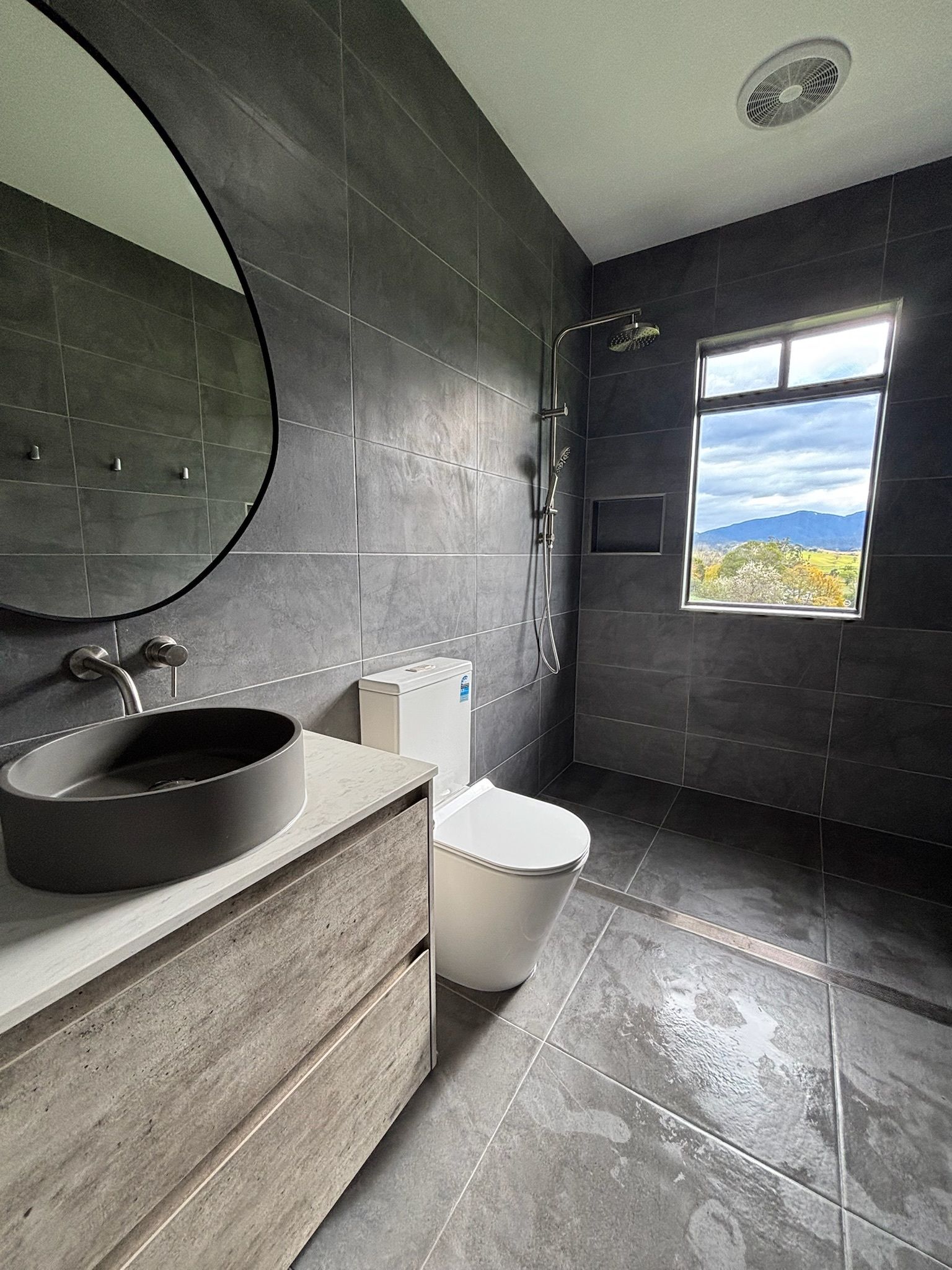 Modern Bathroom With Dark Gray Tile Walls — Edmonds Bathroom Renovations & Tiling In Laurieton, NSW