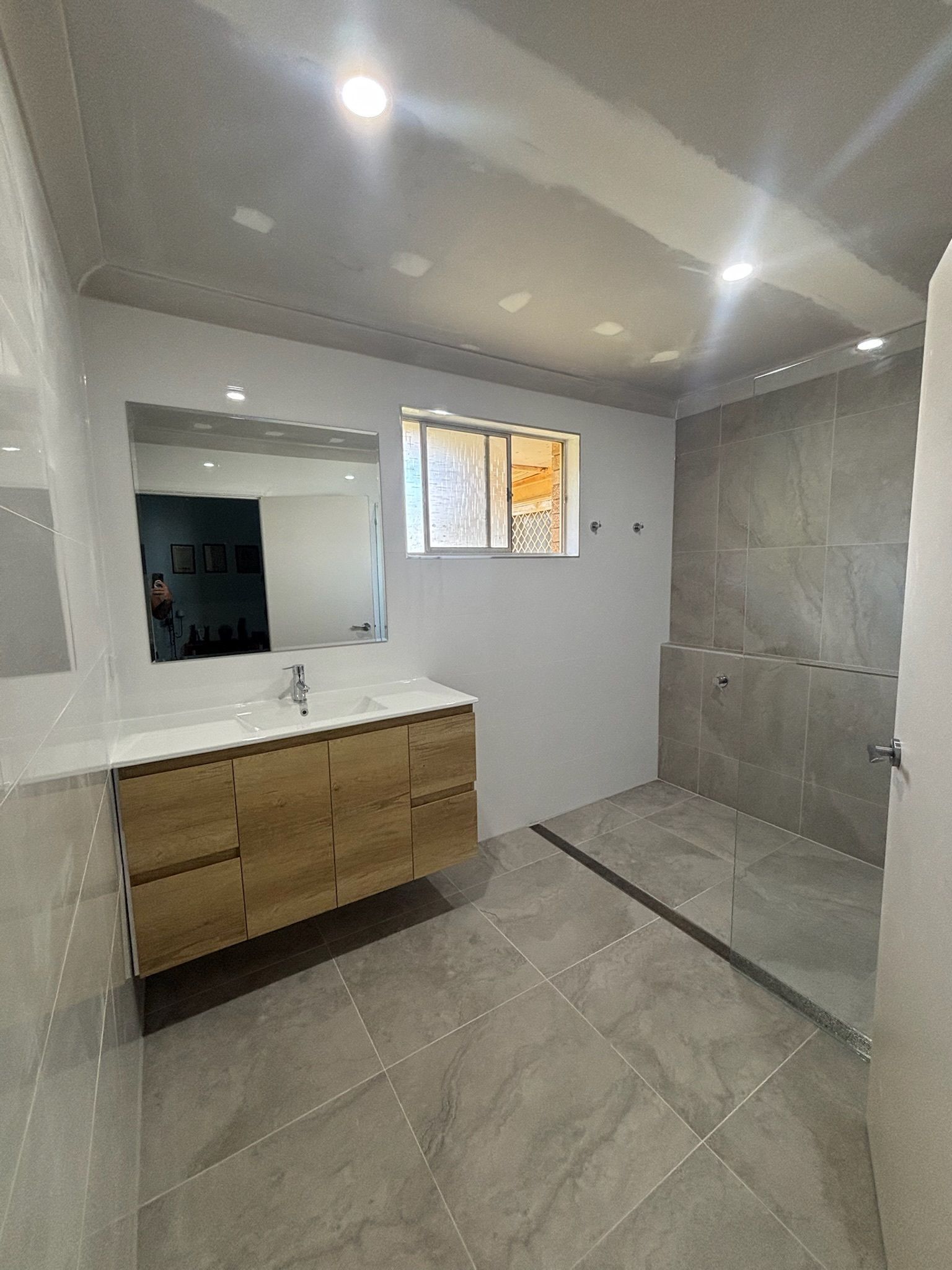 Modern Bathroom With Gray Tiles — Edmonds Bathroom Renovations & Tiling In Port Macquarie, NSW