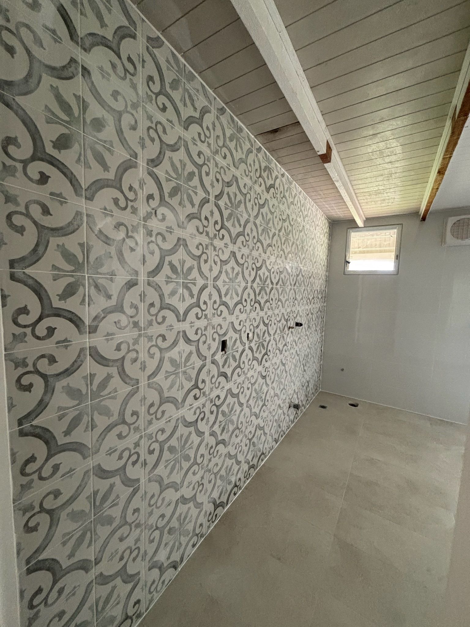 Room With Decorative Patterned Tile Wall, Concrete Floor — Edmonds Bathroom Renovations & Tiling In Lake Cathie, NSW
