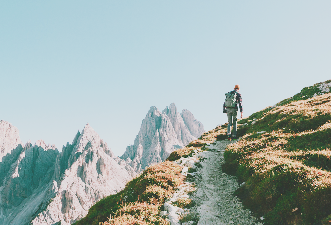 A person climbing a mountain.