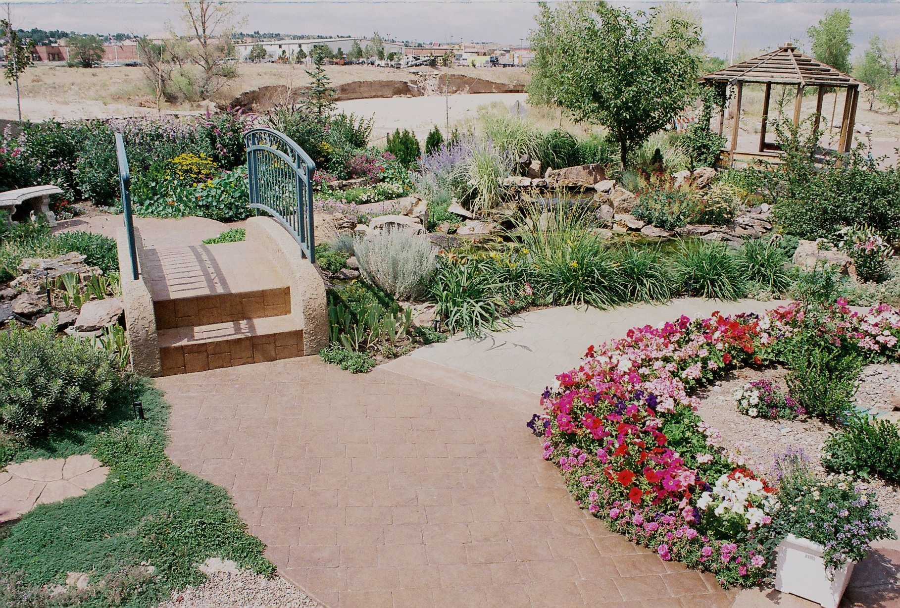 A large house with a concrete driveway leading to it
