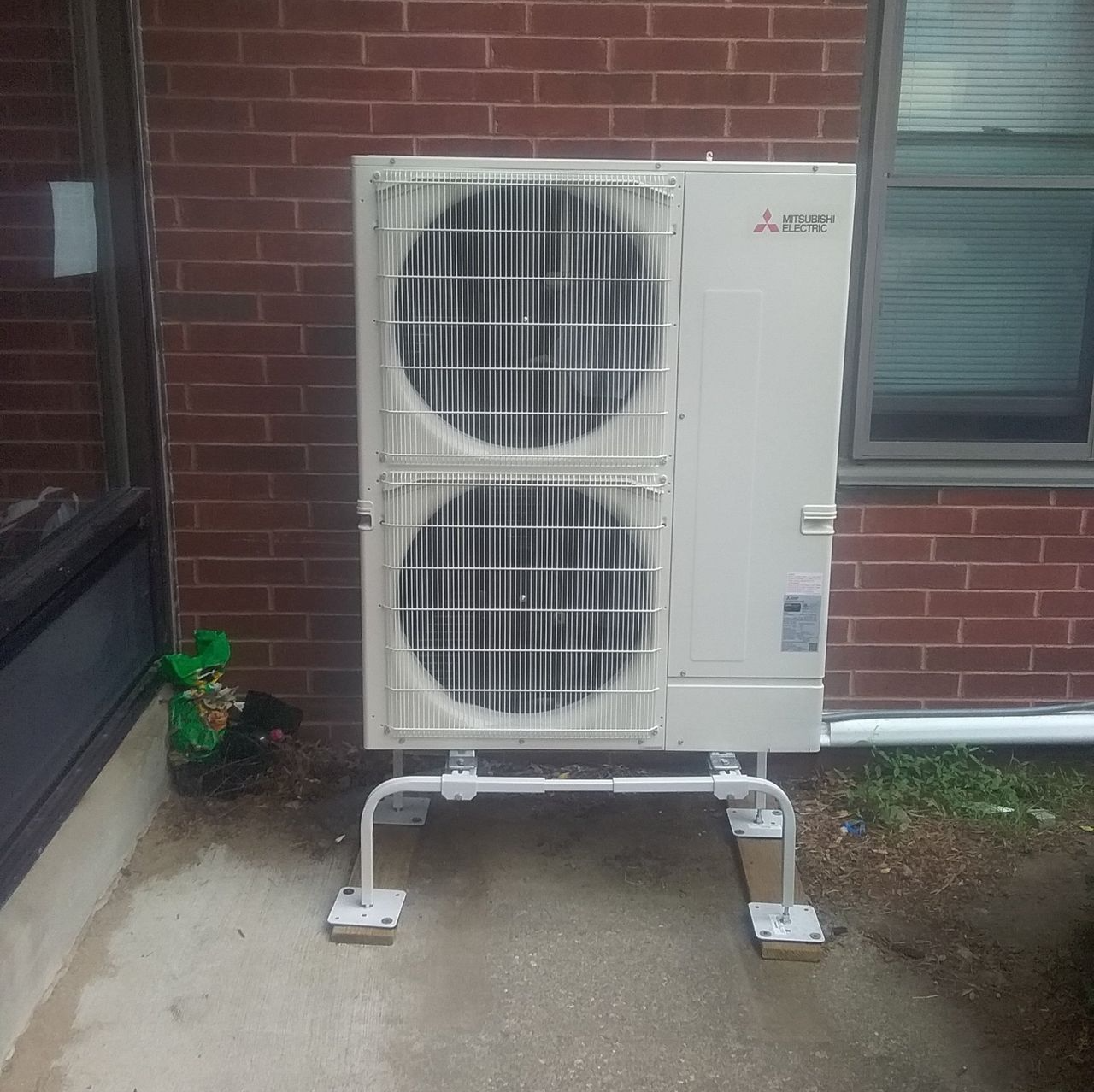 Air Conditioning Units Outside the House — Marlborough MA — Bob Dolan Plumbing, Heating & Remodeling Air Conditioning Units Outside the House — Marlborough MA — Bob Dolan Plumbing, Heating & Remodeling
