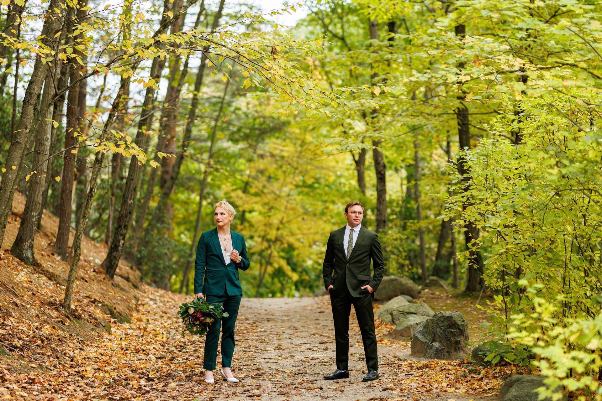 Gay couple posing on wooded trail