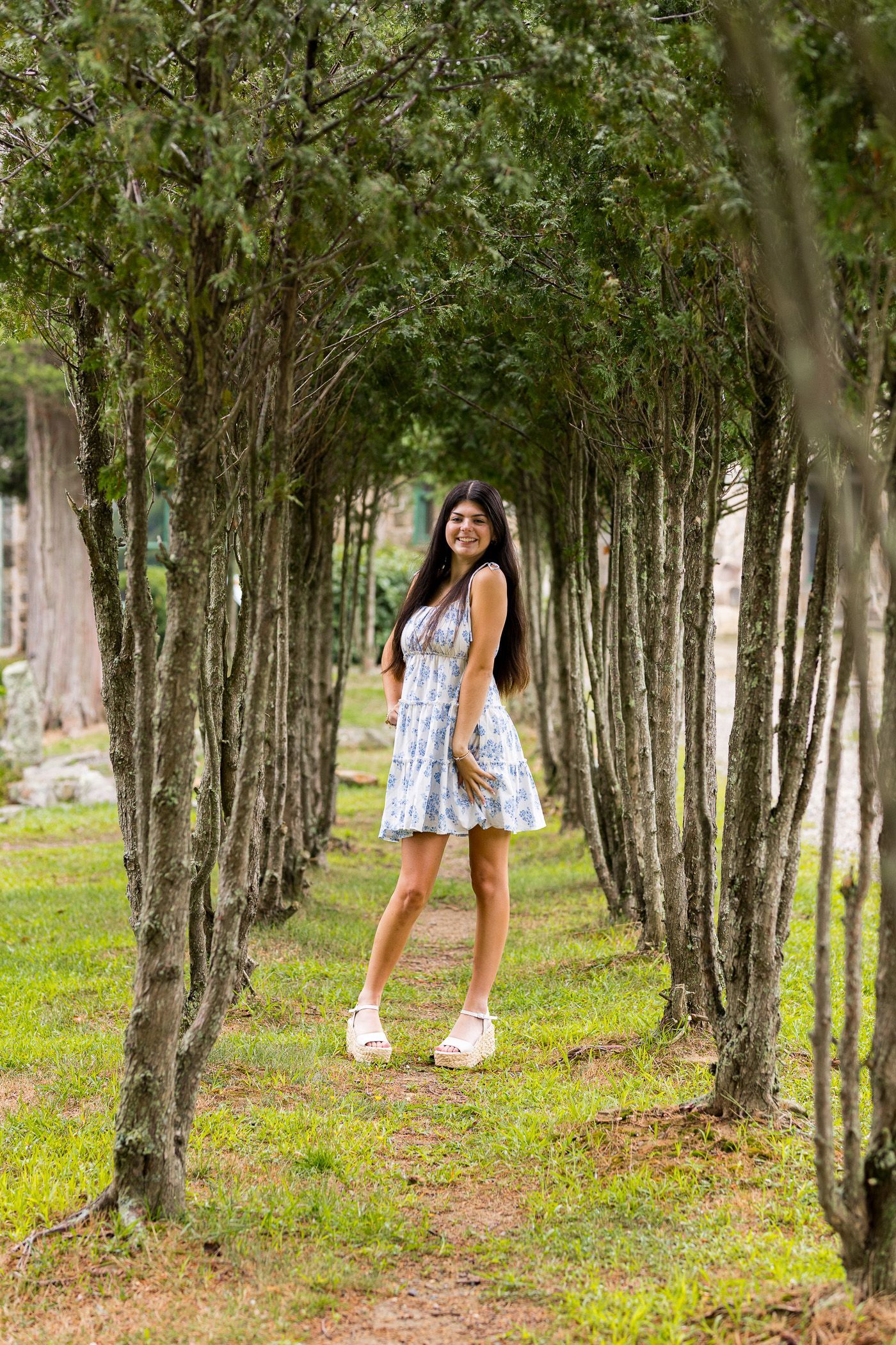 High school senior - senior photography - female student posing in tree tunnel