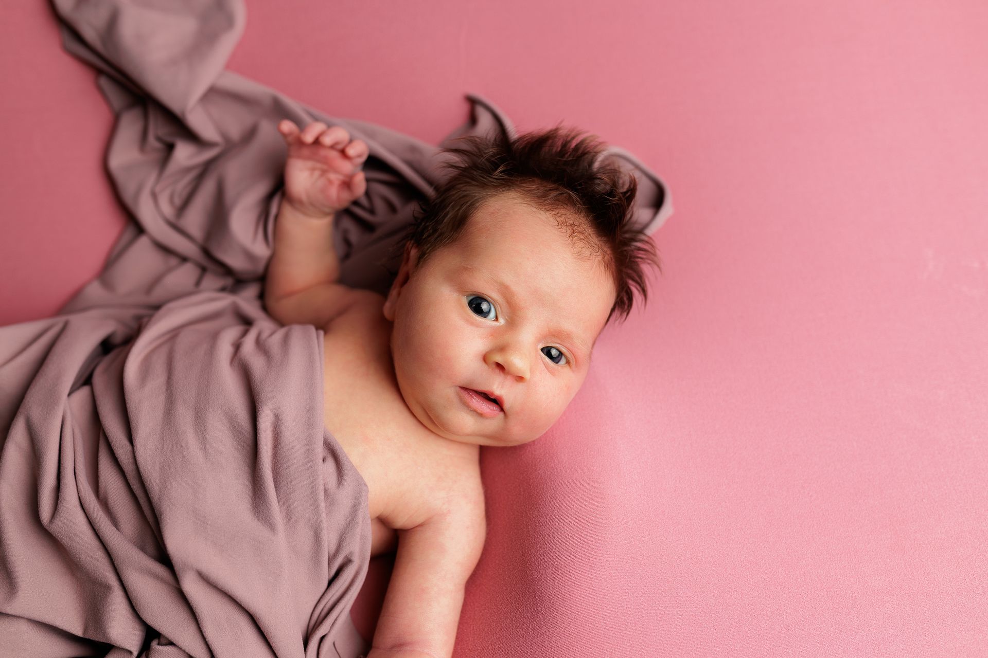 Newborn photography baby girl swaddled