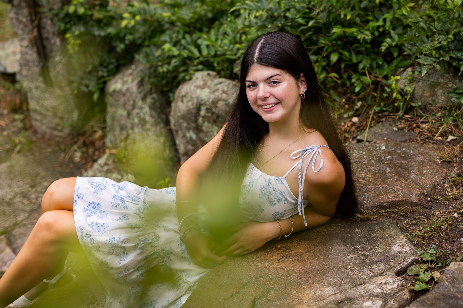 High school senior - senior photography - female student lounging on stone steps