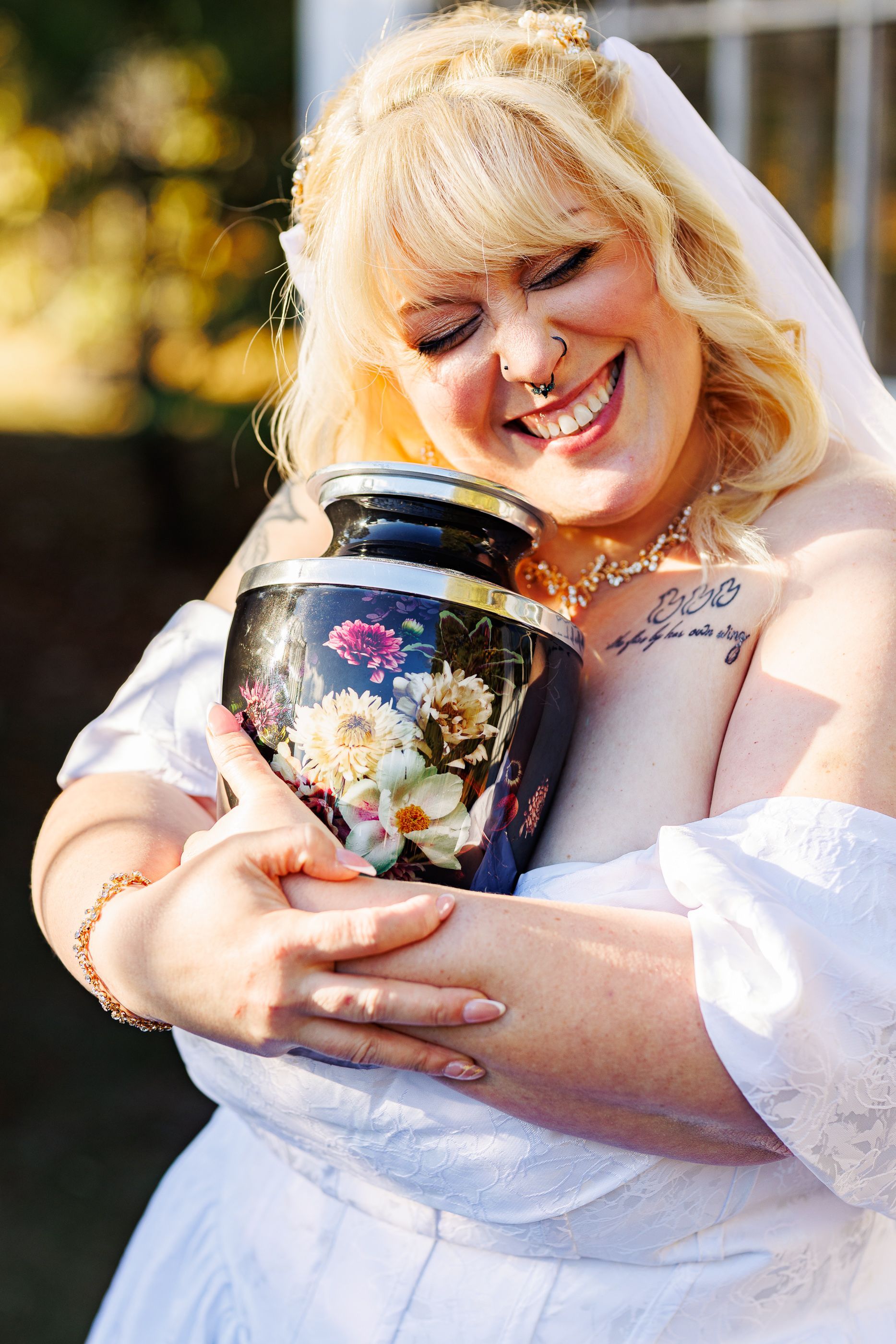 bride posing with mom's urn at Mariposa Chapel in Iron Station, NC