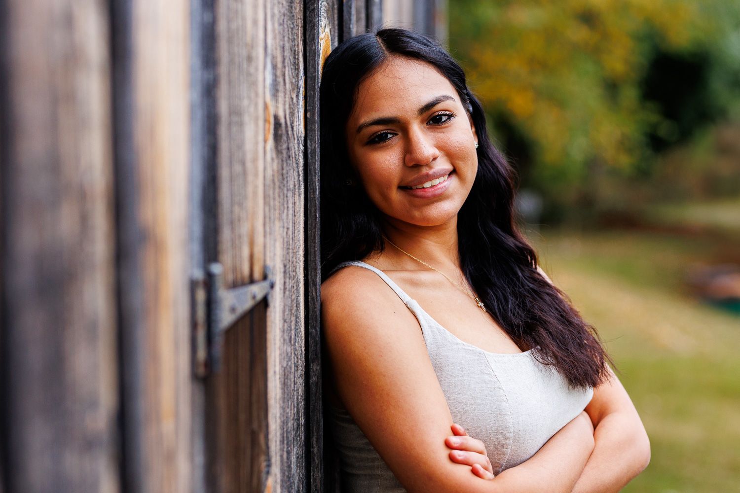 High school senior - senior photography - female student leaning again building