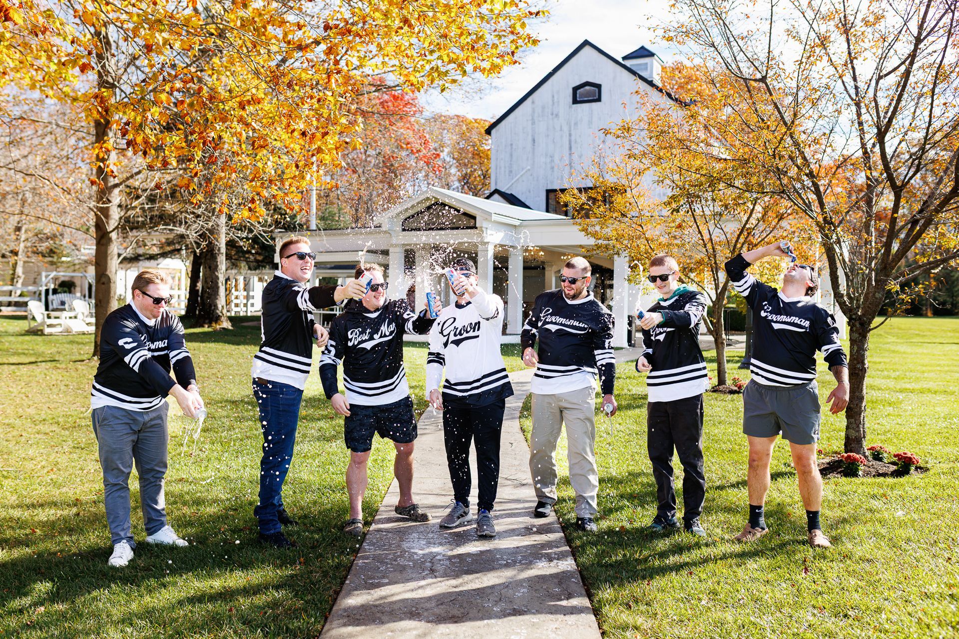 Groom with groomsmen beer shots at Five Bridge Inn wedding