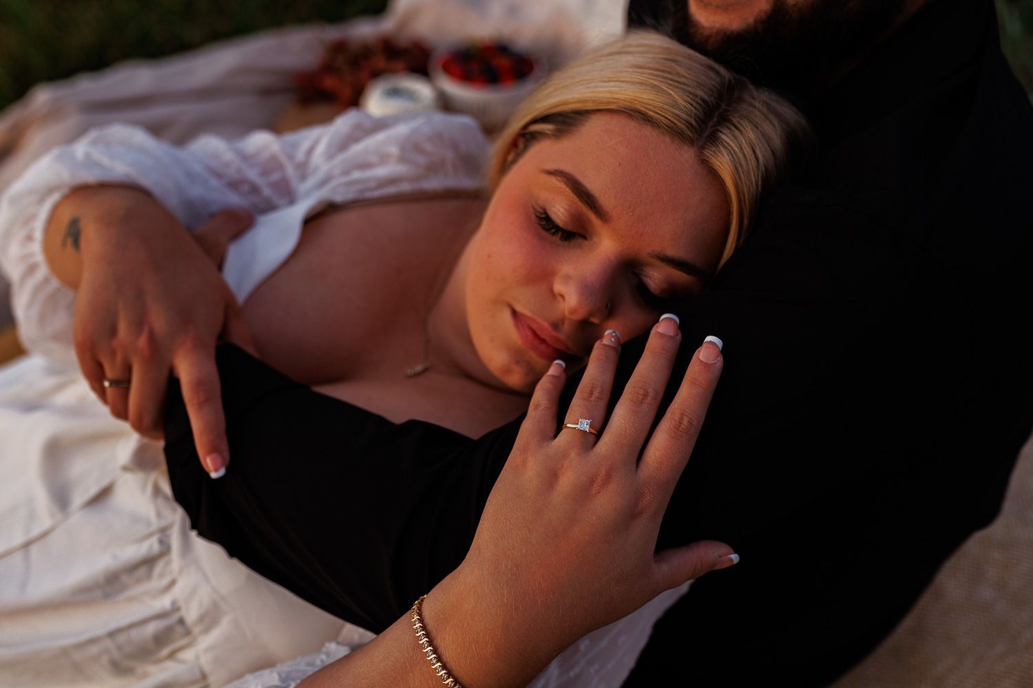 Picnic themed engagement session with close-up ring shot
