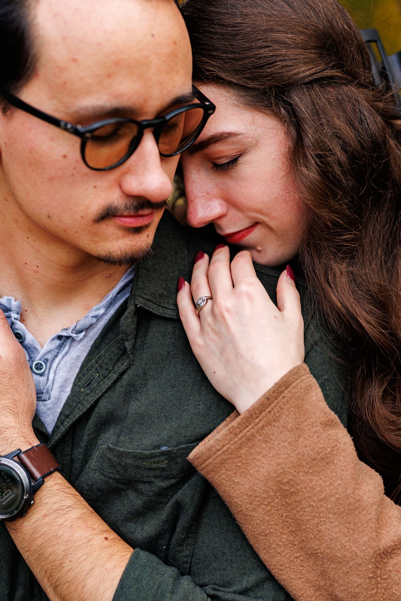 Couple cuddling during engagement session