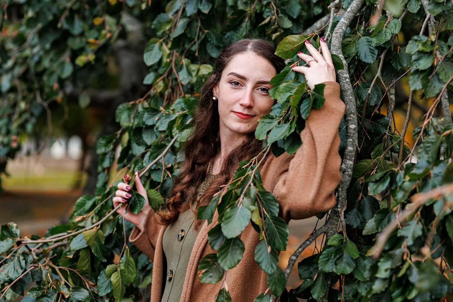 Women posing in Willow tree during engagement session