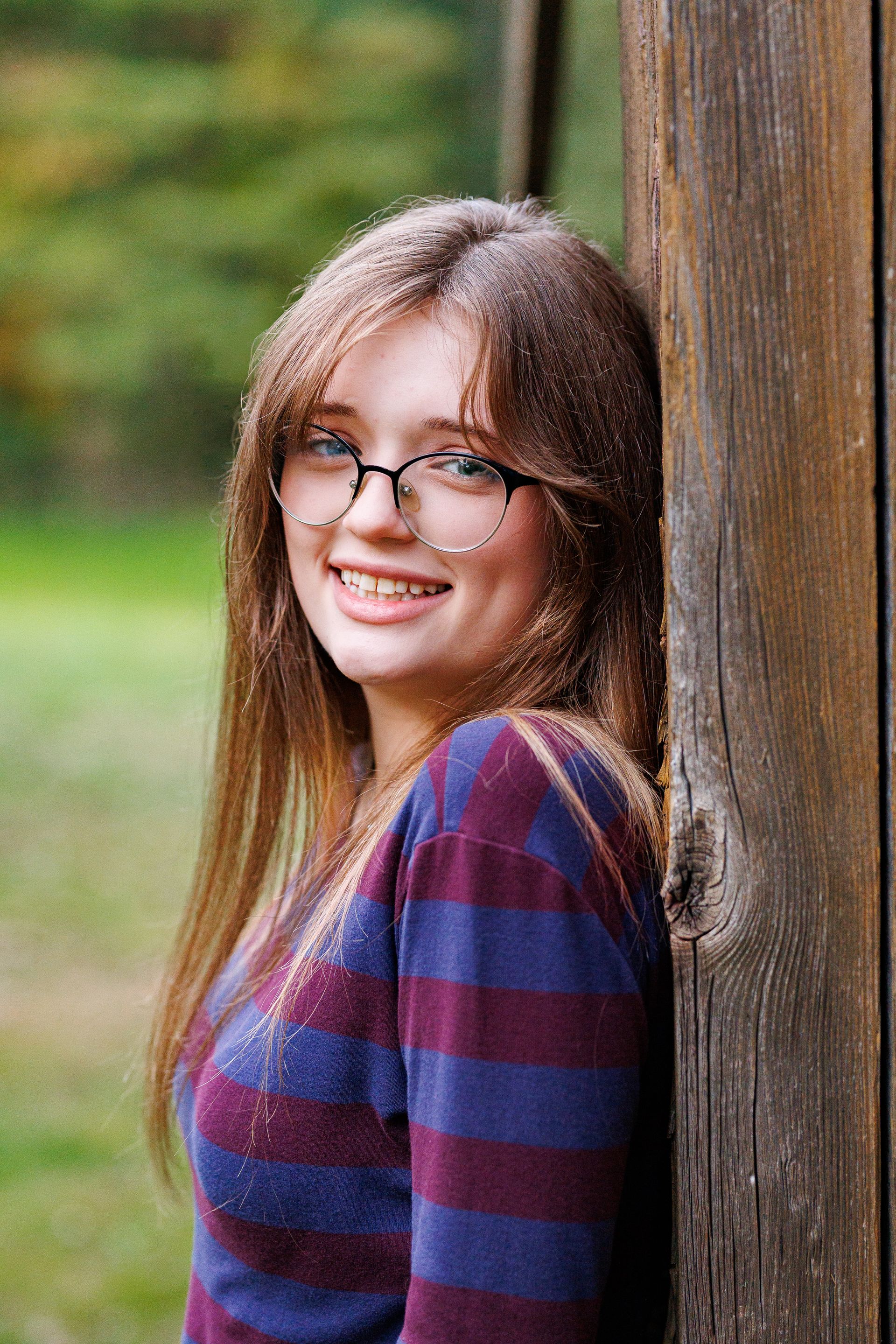 High school senior - senior photography - female student posing on farm