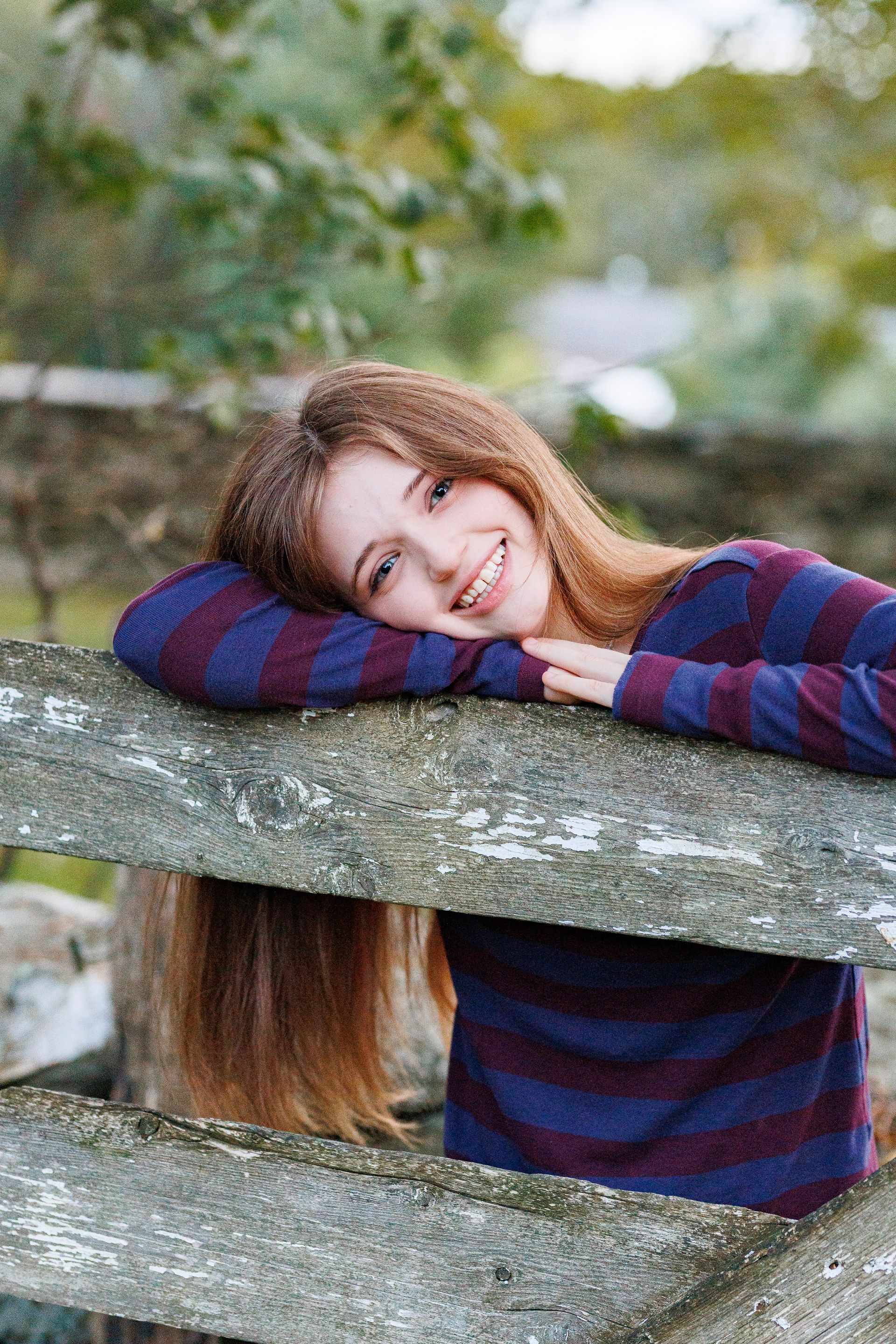 High school senior - senior photography - female student posing on farm