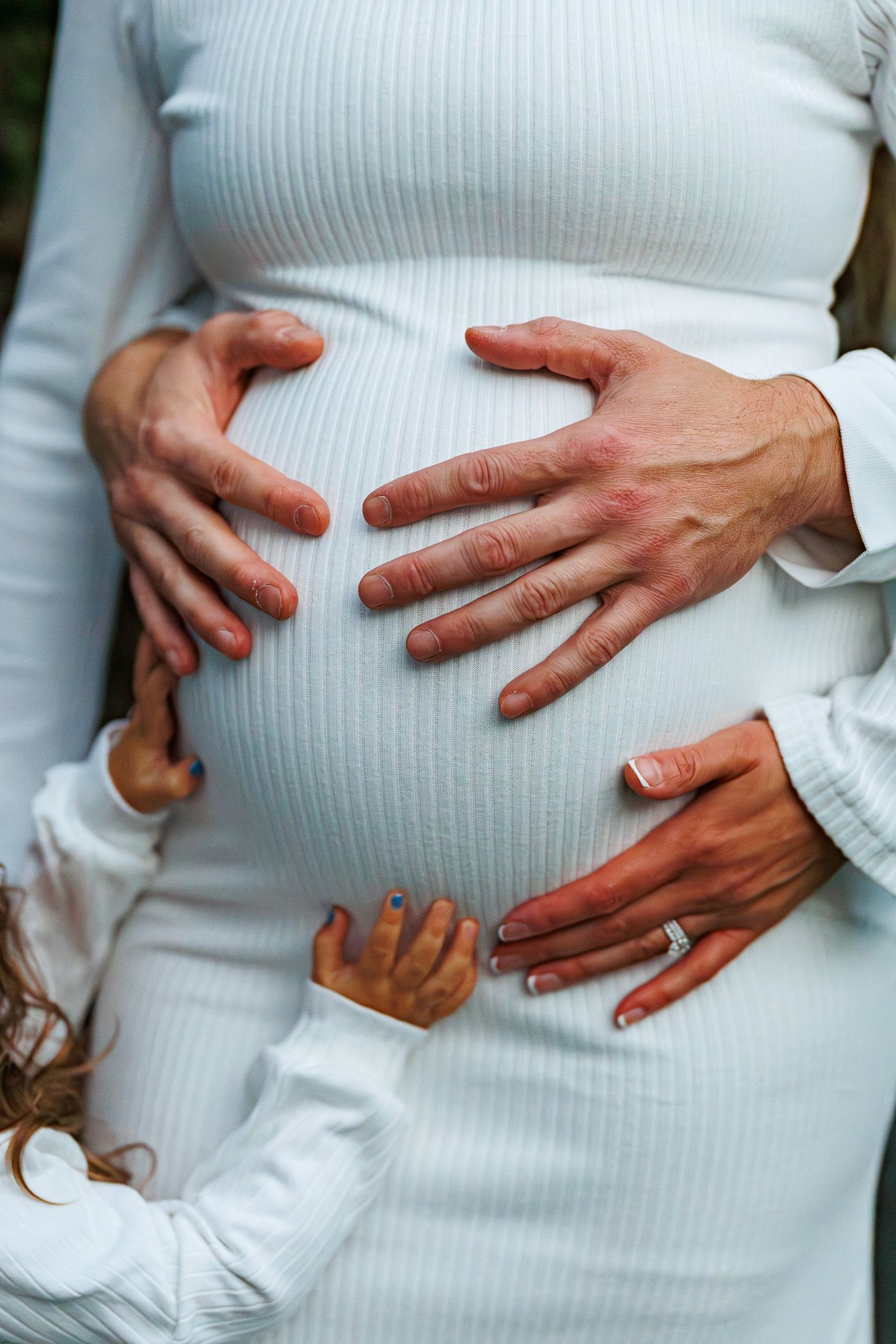 Maternity photography hands on belly