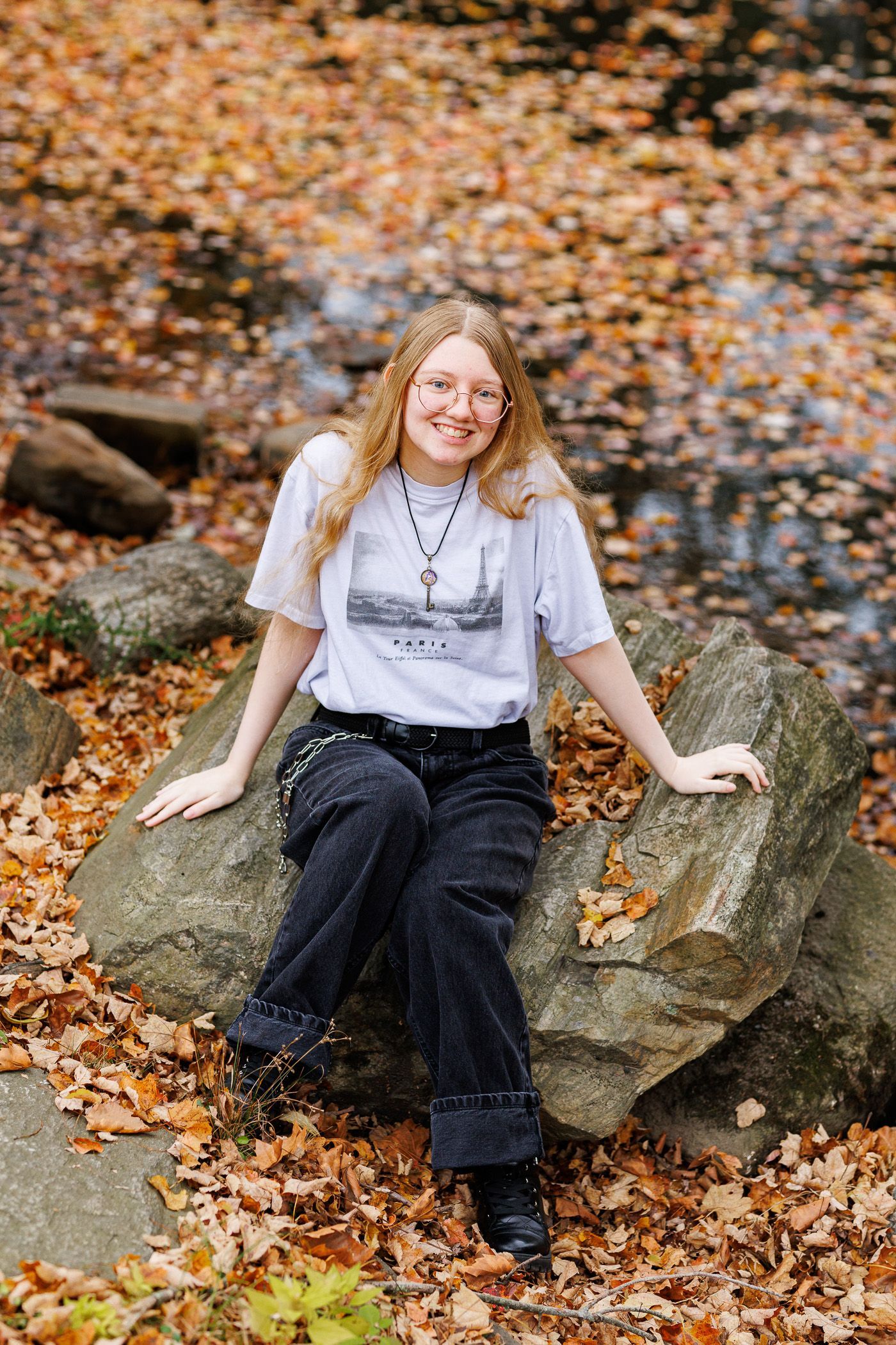 High school senior - senior photography - female student sitting in front of waterfront
