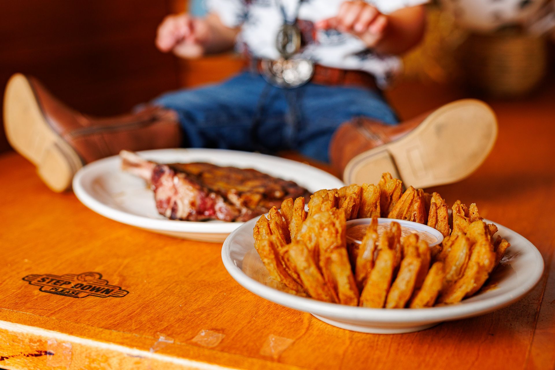 Baby posing at Texas Roadhouse for a cowboy steak smash session
