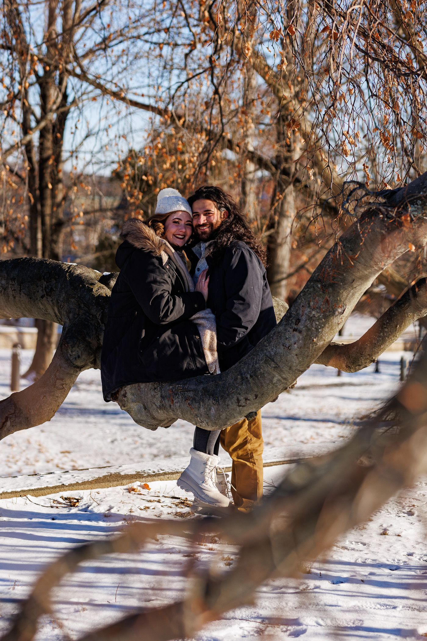 snowscape engagement session with couple hugging