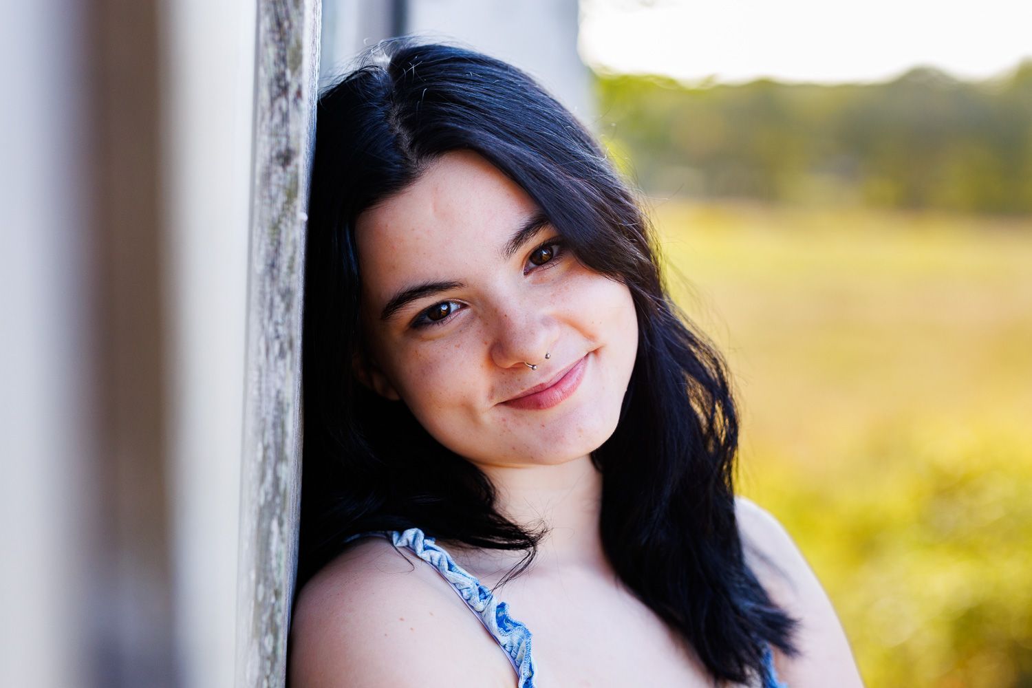 High school senior - senior photography - female student leaning against building