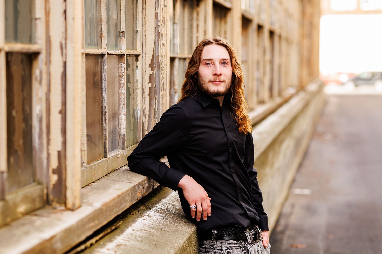 High school senior - senior photography - male student leaning on window sill