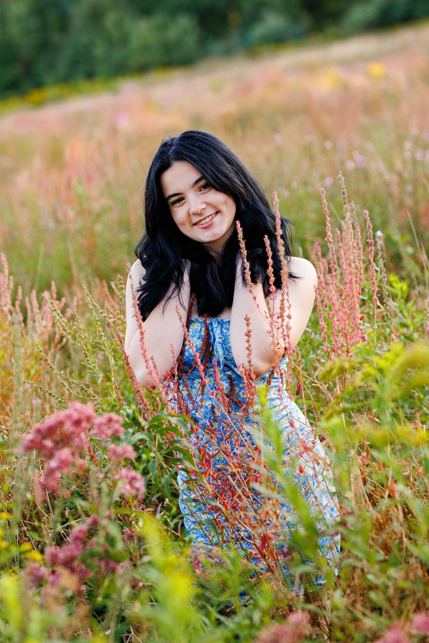 High school senior - senior photography - female student posing in flower field