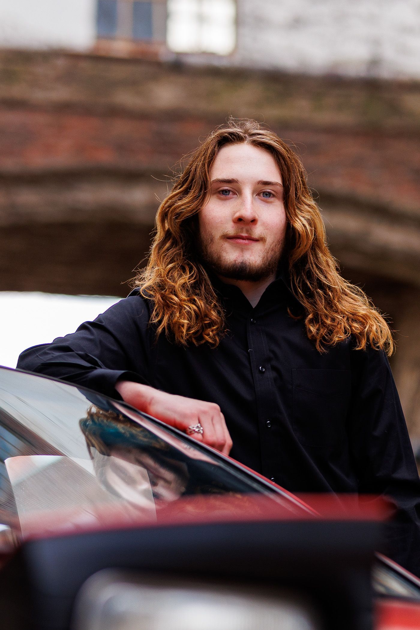 High school senior - senior photography - male student posing with car