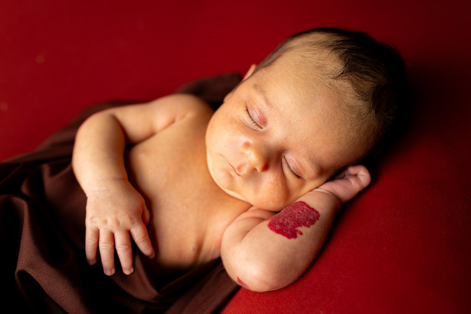 Newborn photography baby boy swaddled