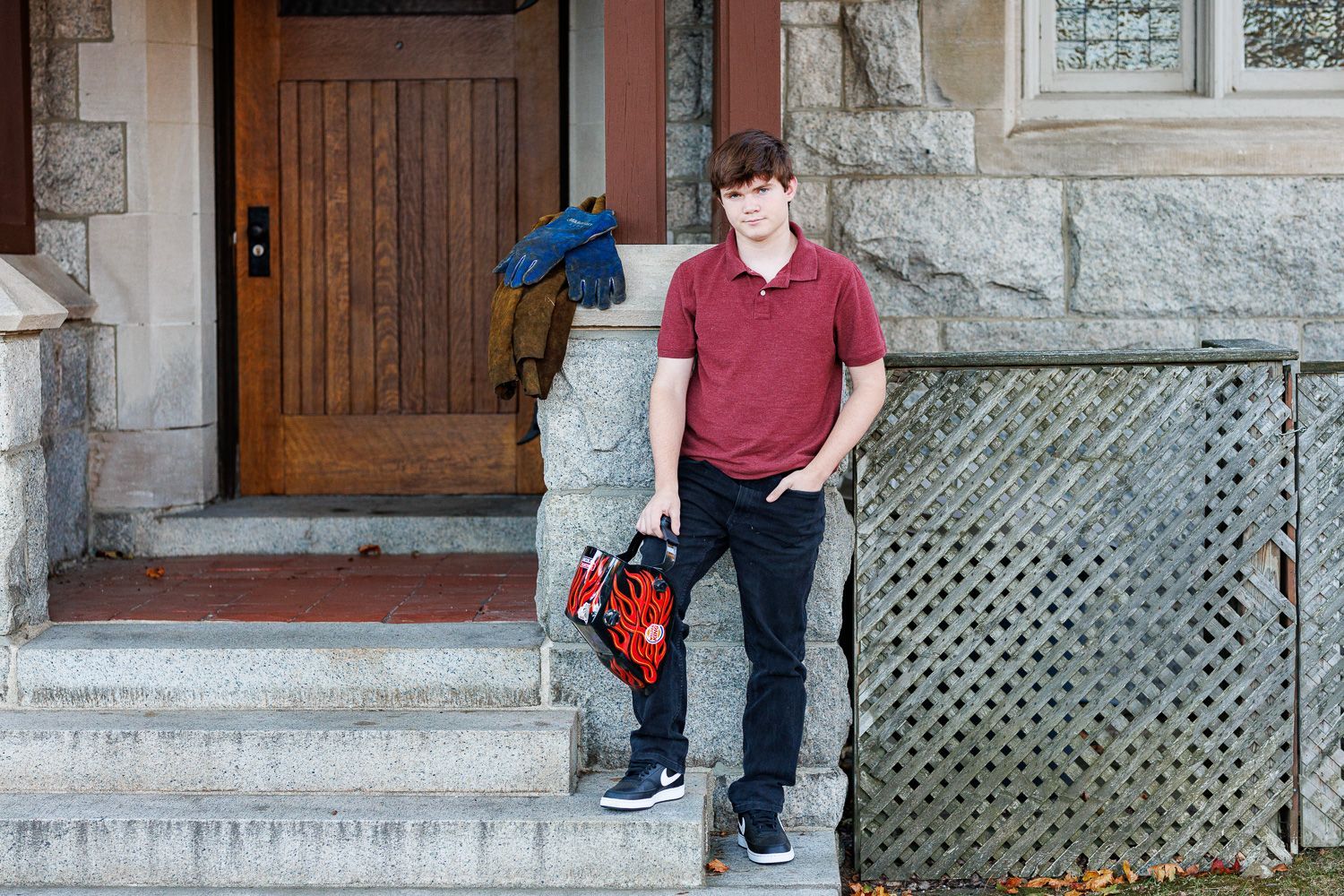 High school senior - senior photography - male student posing with welding equipment