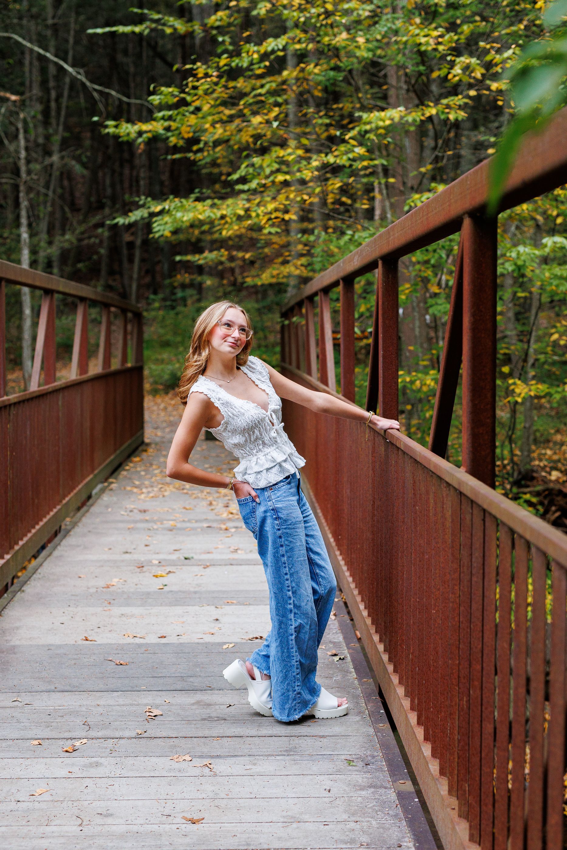High school senior - senior photography - female student on bridge