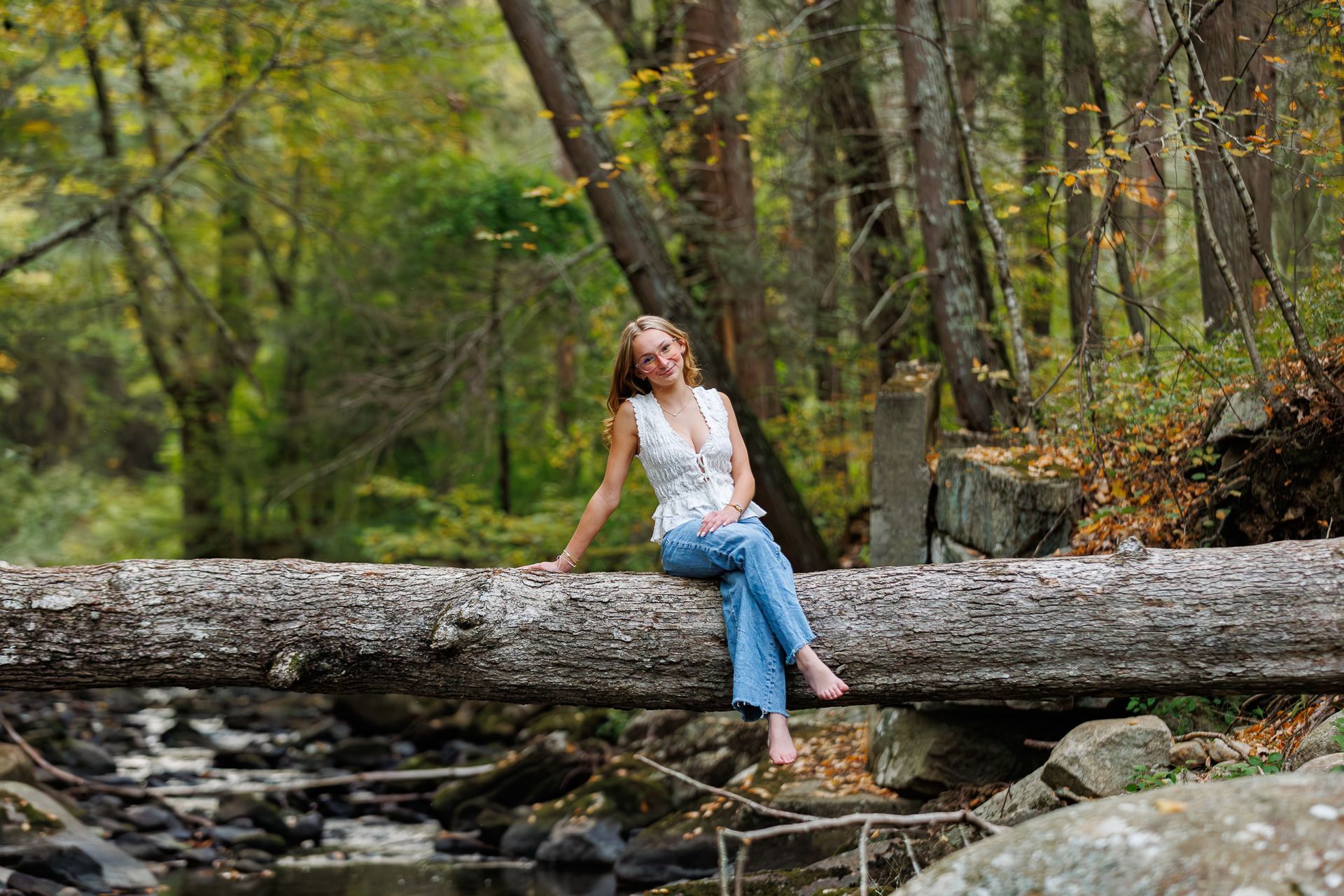 High school senior - senior photography - female student sitting on tree