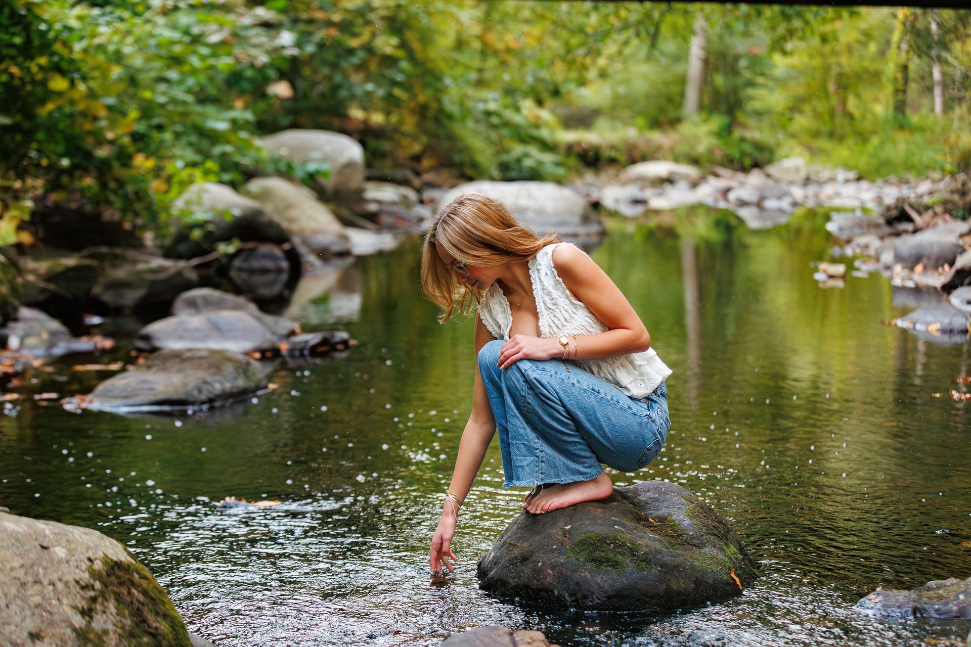 High school senior - senior photography - female student sitting in river