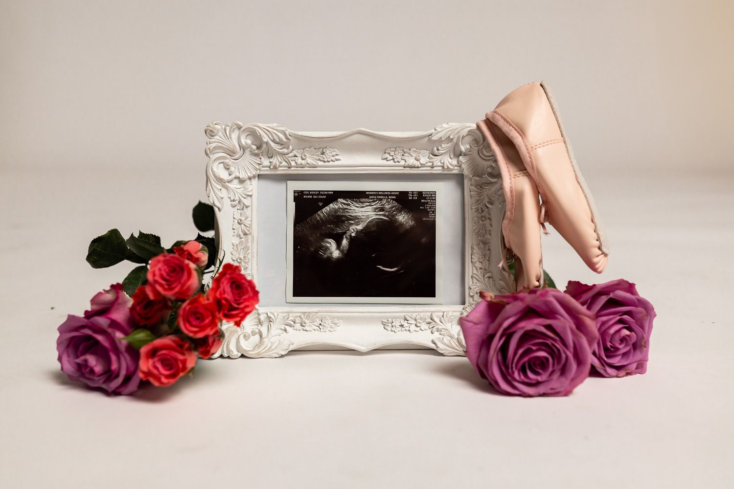 Maternity photography ultrasound in frame with flowers
