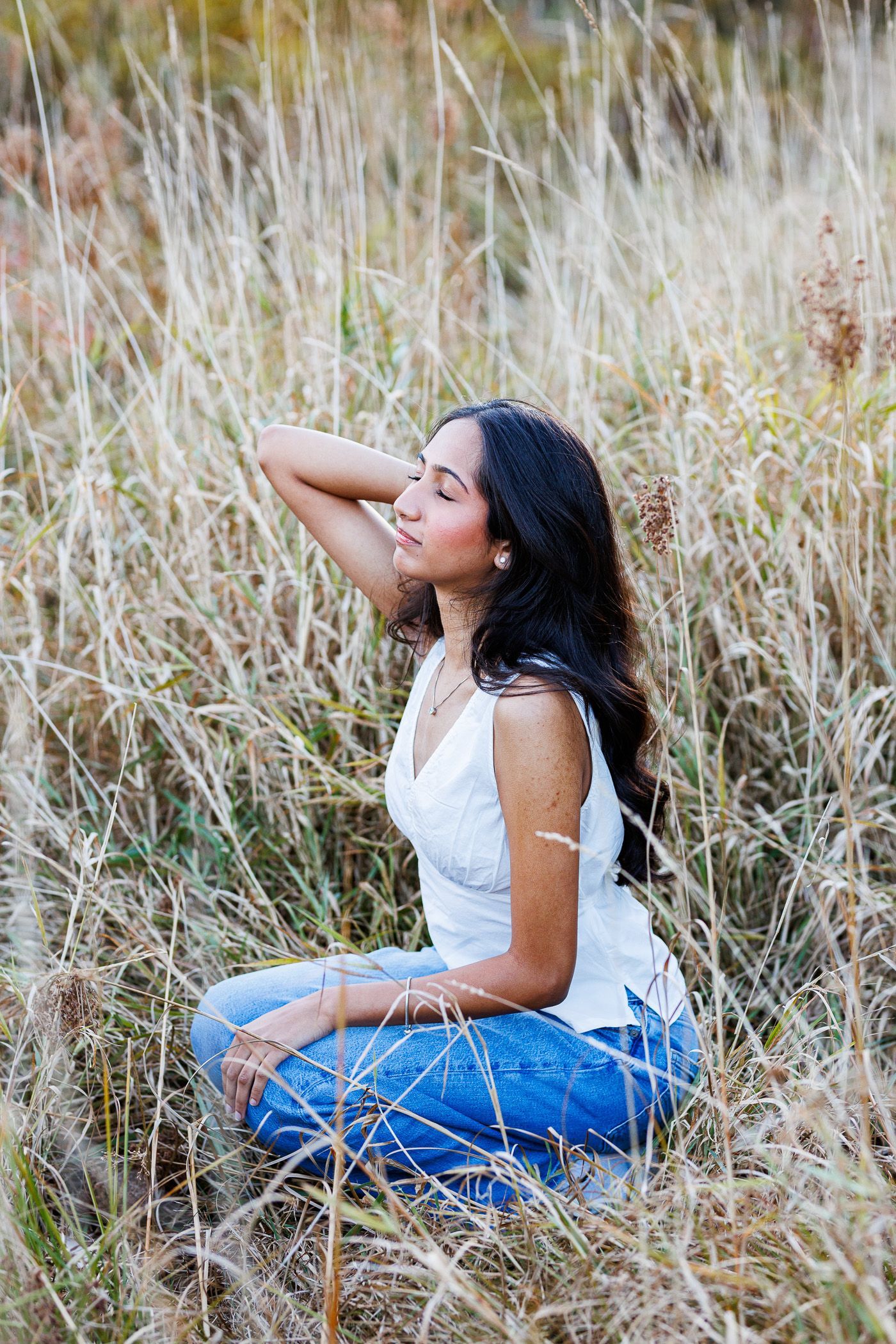 High school senior - senior photography - female student posing in field