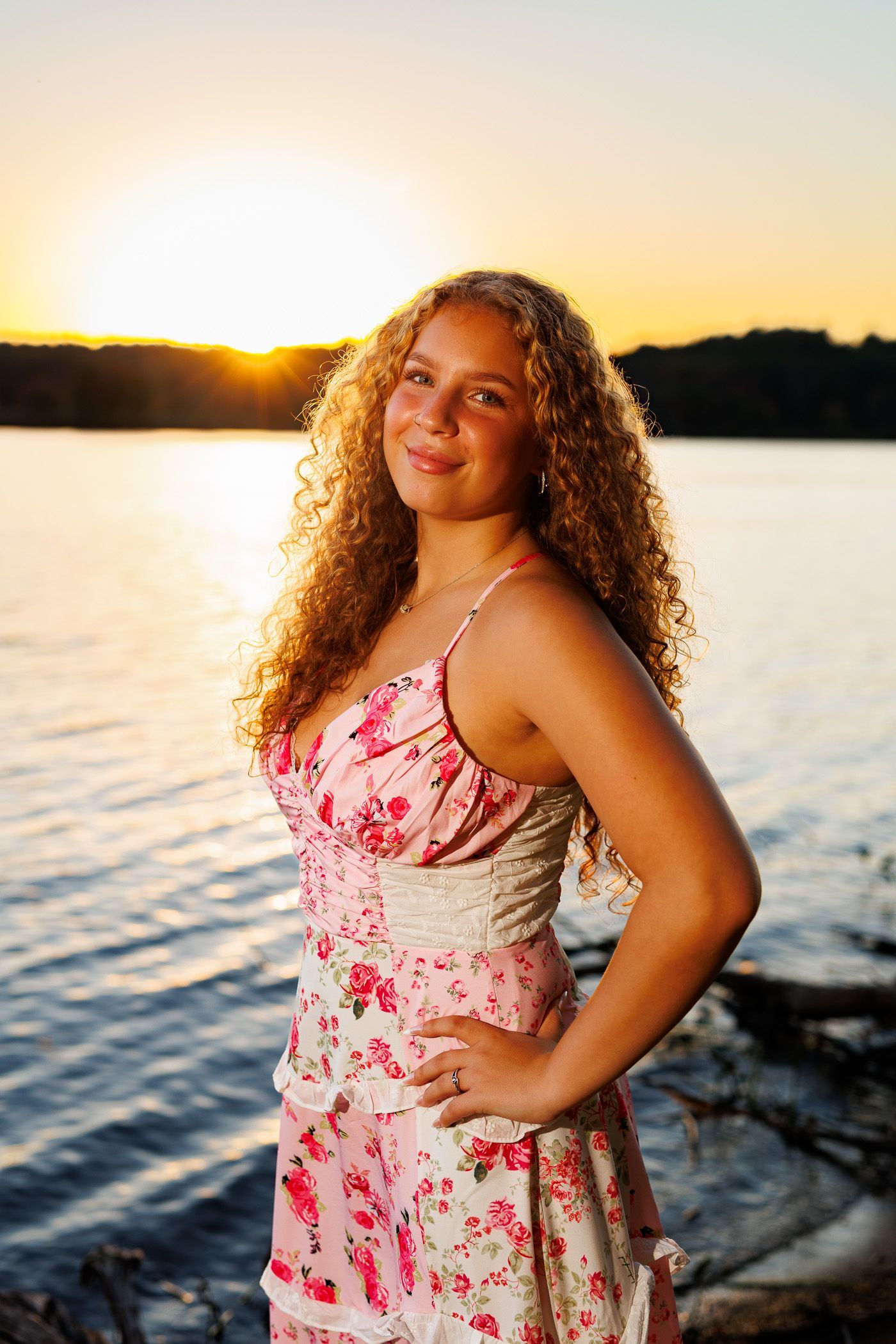 High school senior - senior photography - female student posing in front of sunset