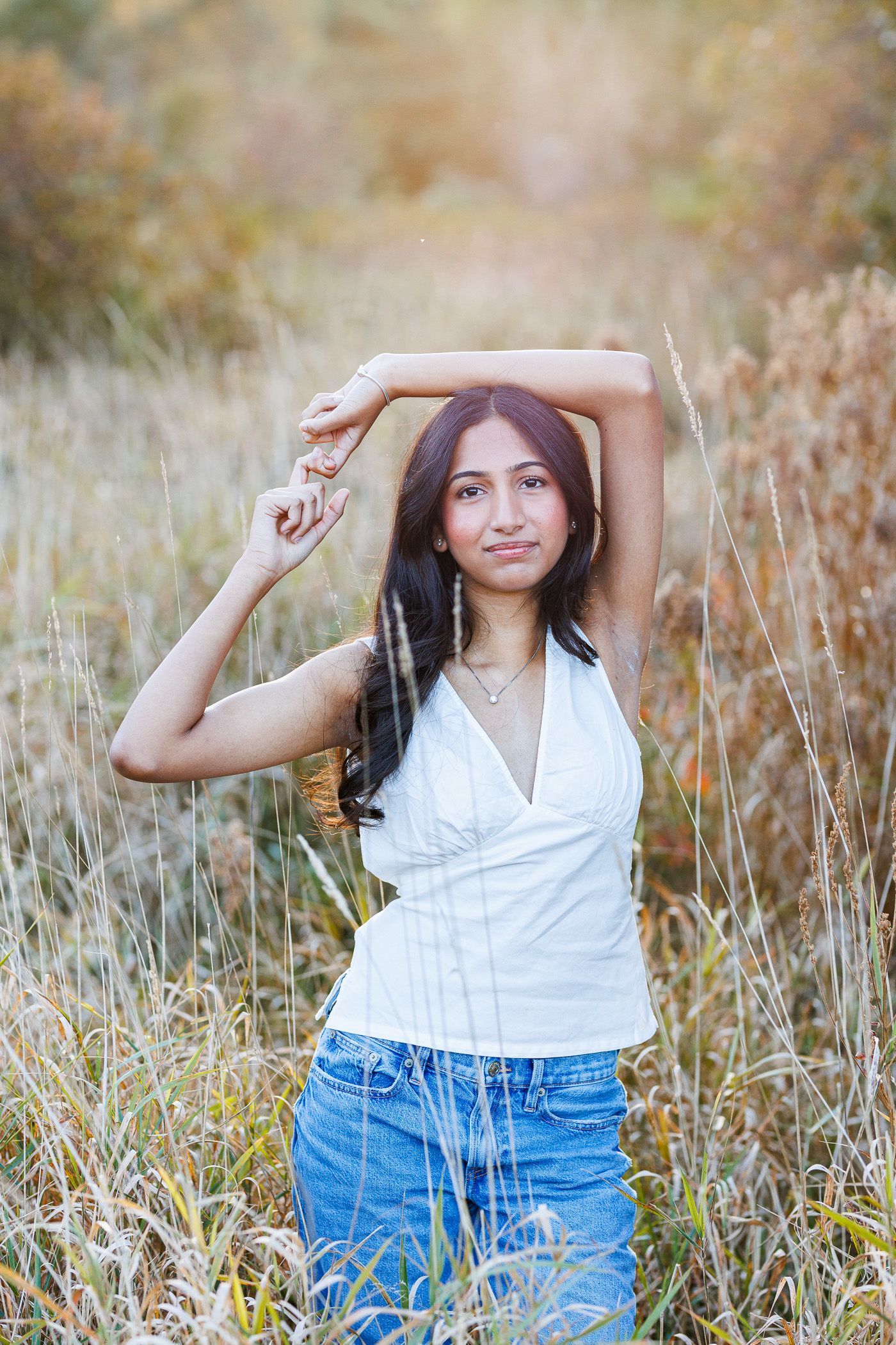 High school senior - senior photography - female student posing in field