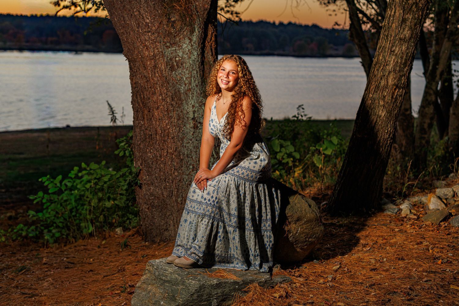 High school senior - senior photography - female student posing in front of sunset