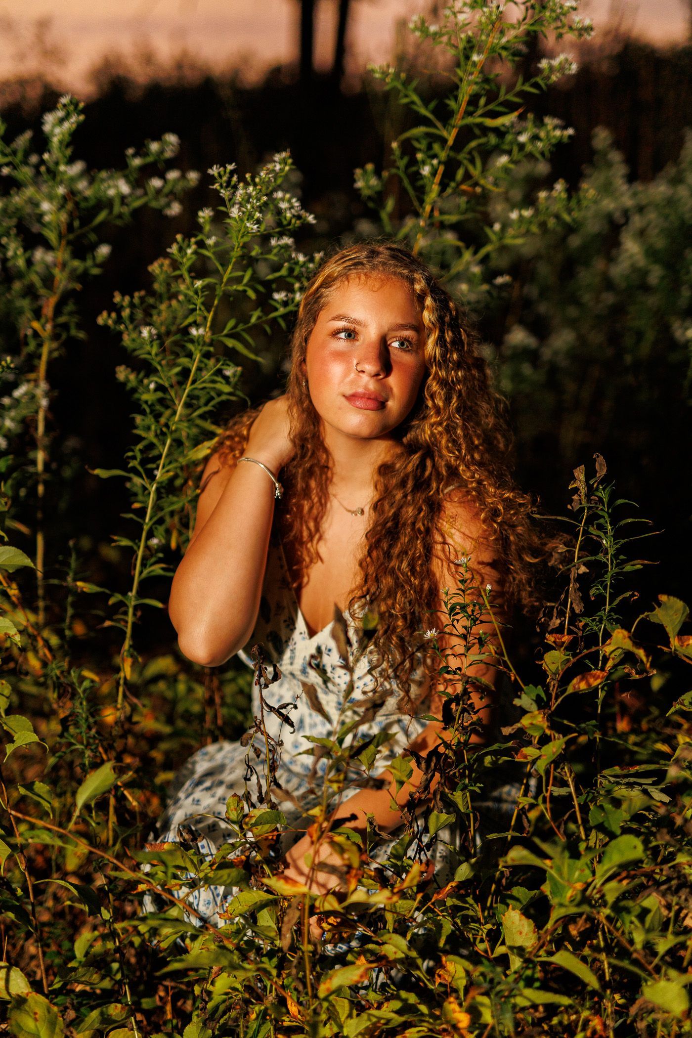 High school senior - senior photography - female student posing in front of sunset