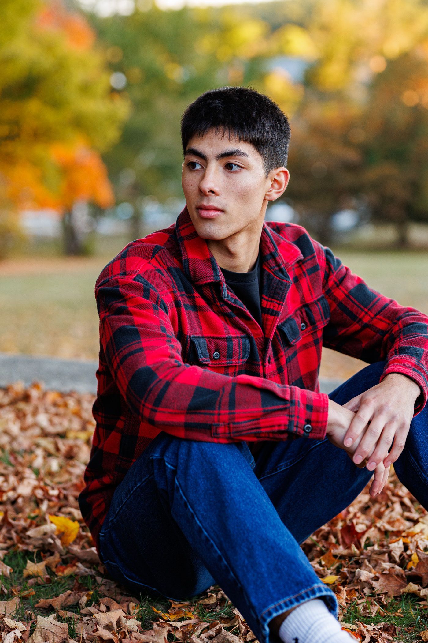 High school senior - senior photography - male student sitting on ground