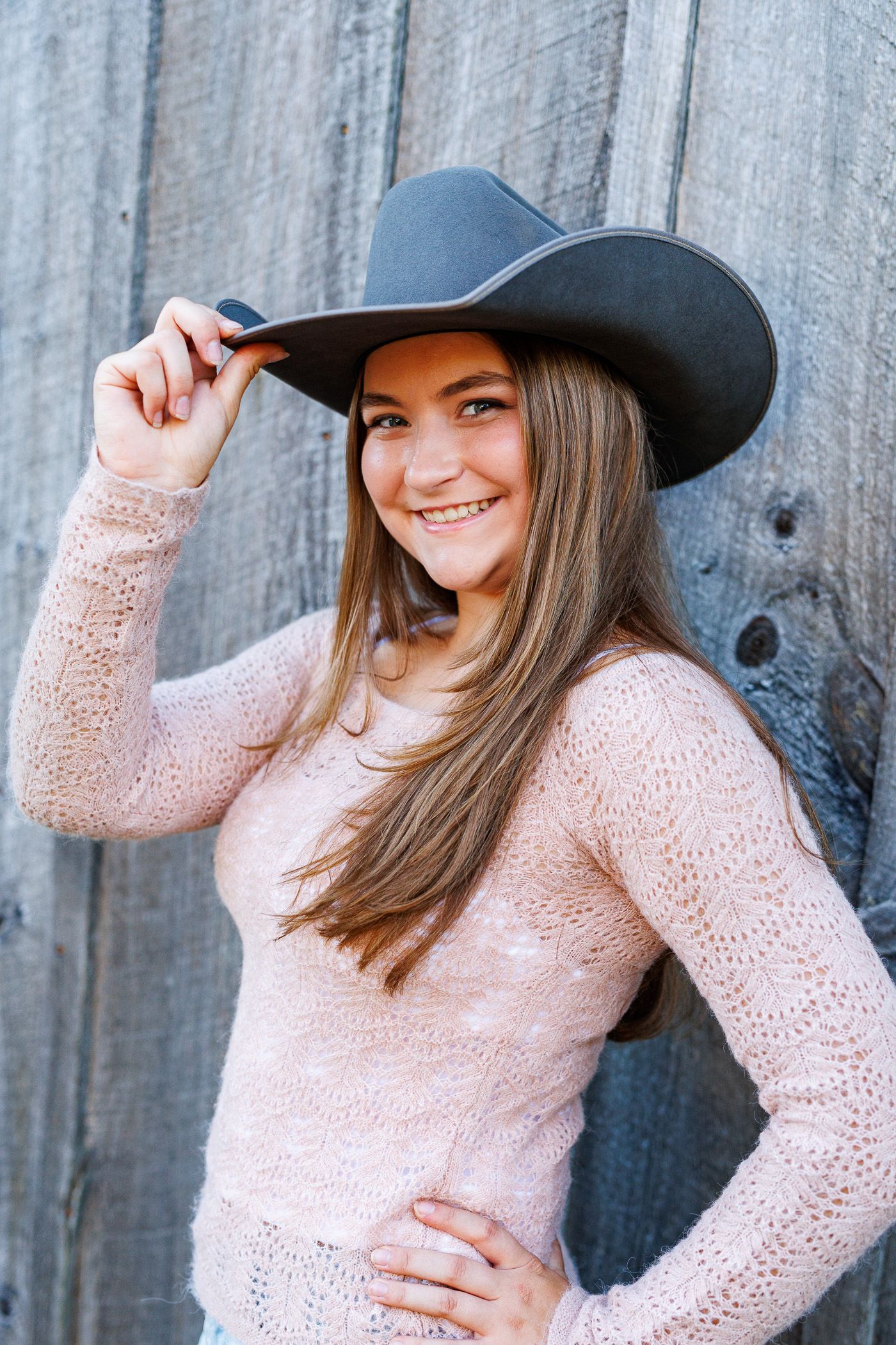High school senior - senior photography - female student posing with cowboy hat