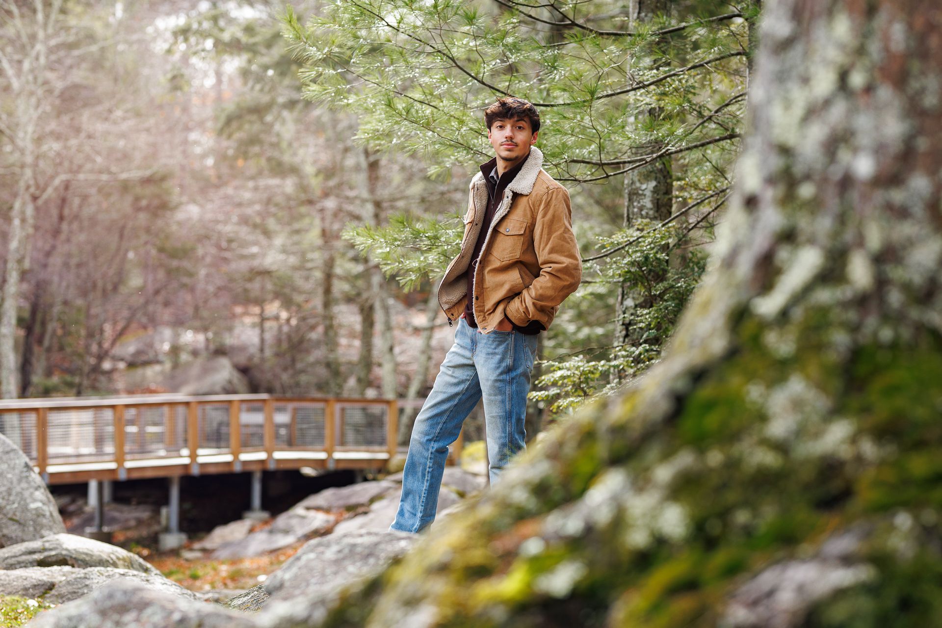 High school senior - senior photography - male student standing in forest setting