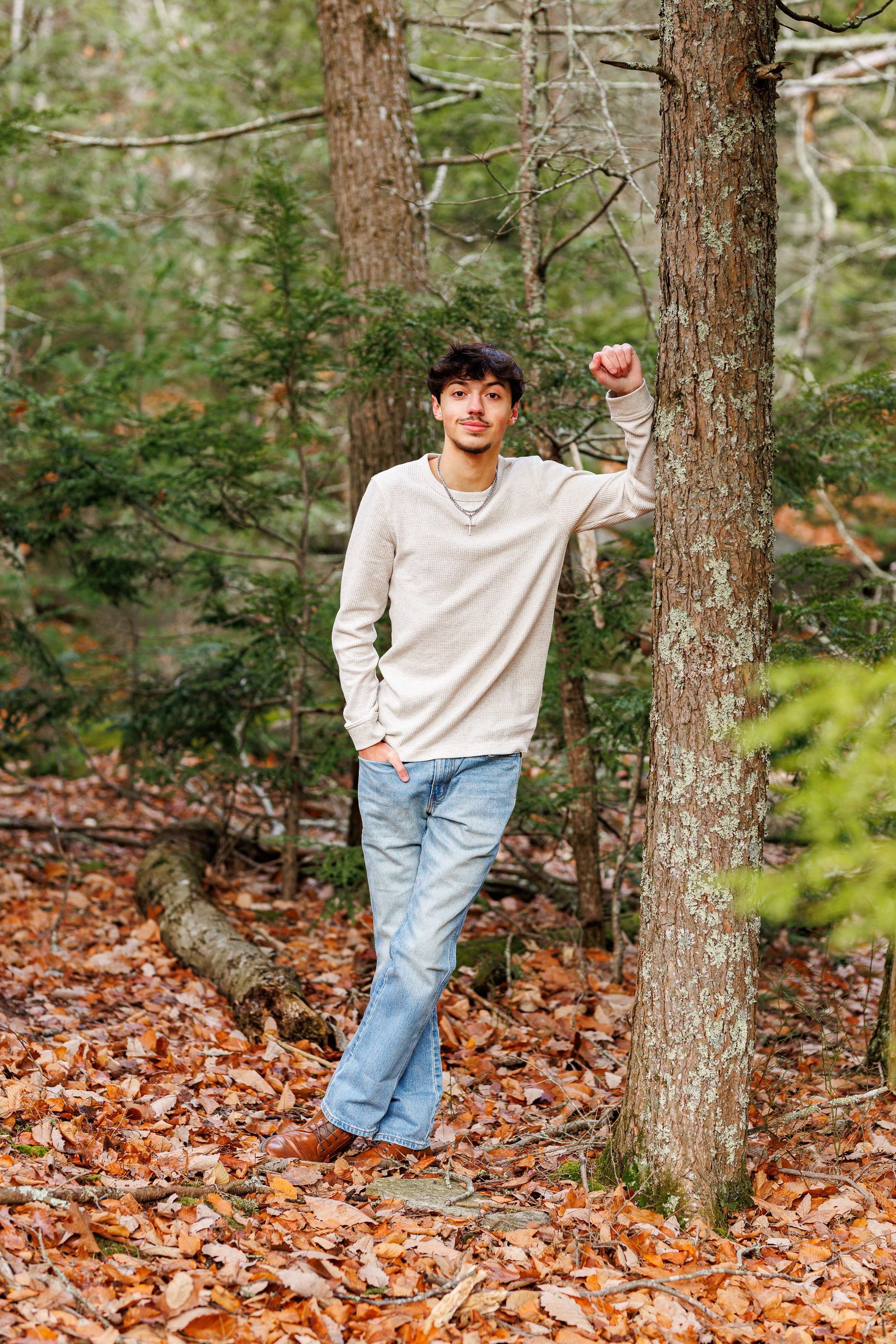 High school senior - senior photography - male student leaning on tree
