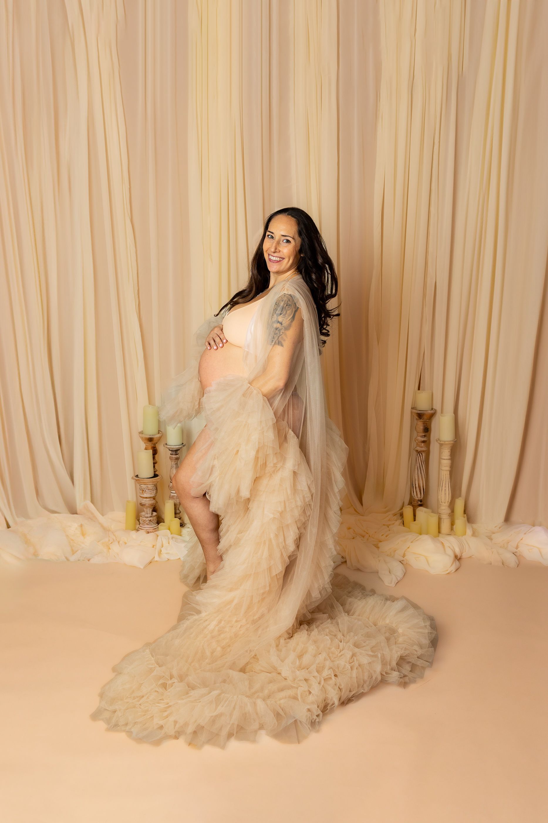 Maternity photography mom posing while holding belly