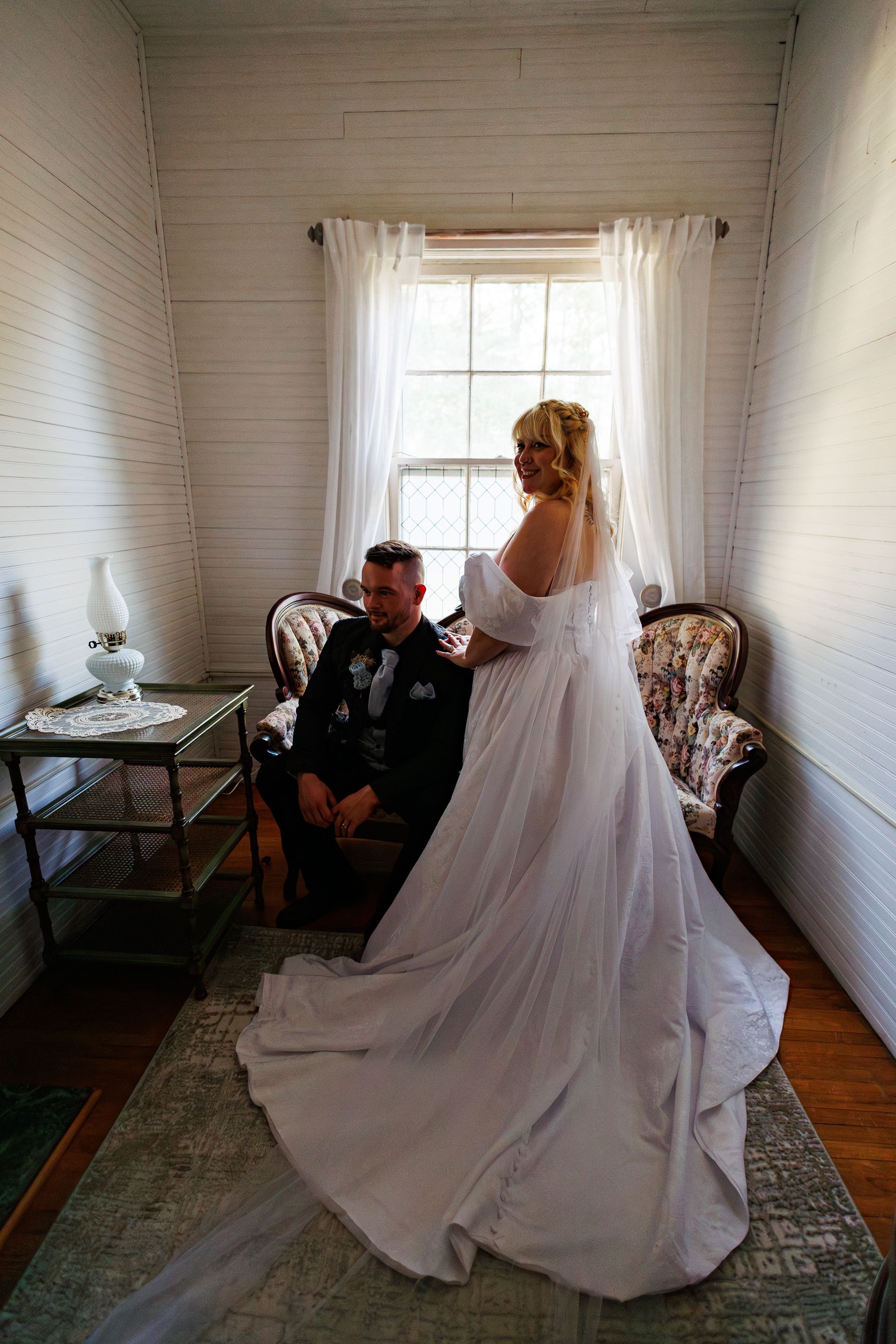 Couple posing at Mariposa Chapel in Iron Station, NC