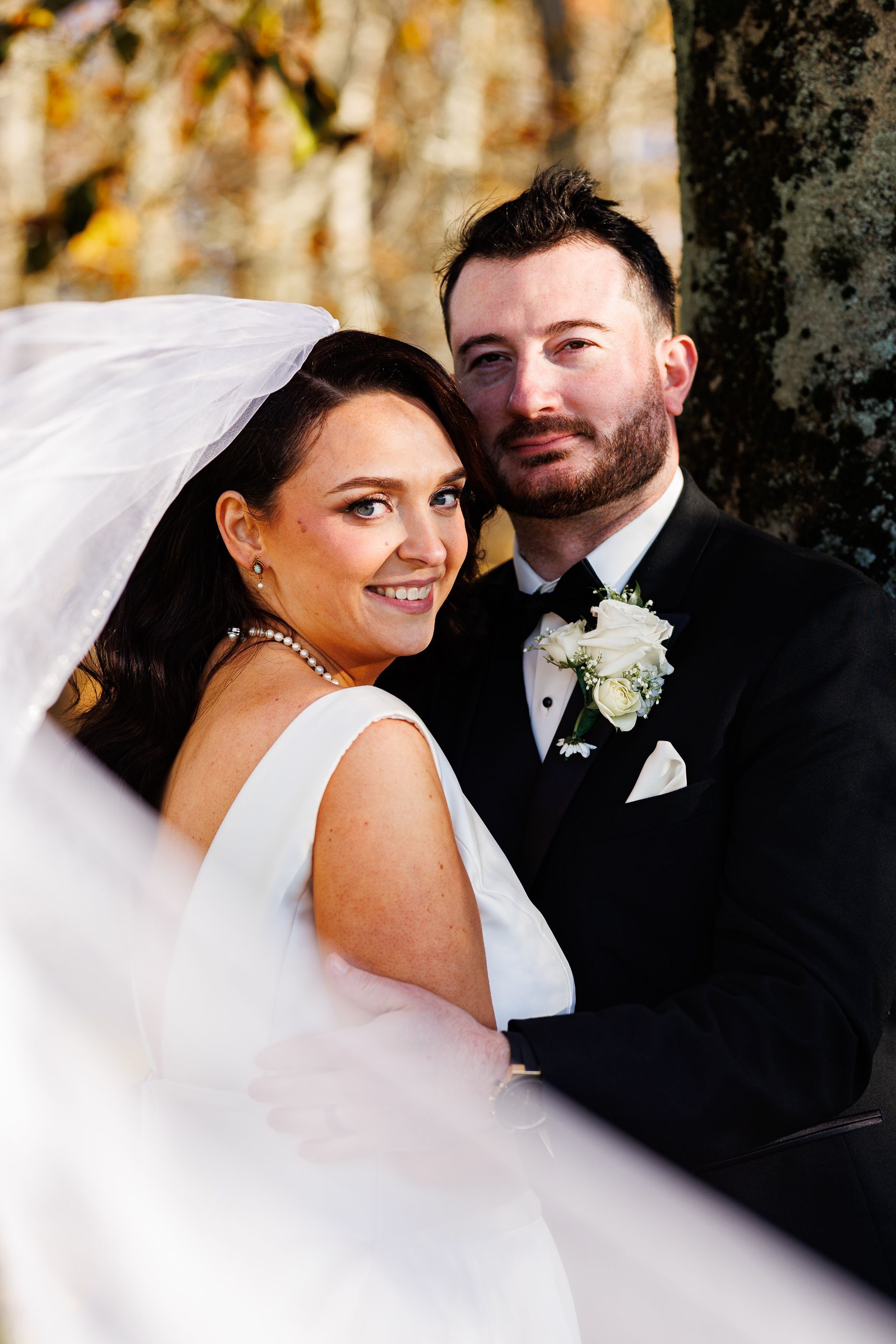 Bride and groom snuggling at Five Bridge Inn wedding