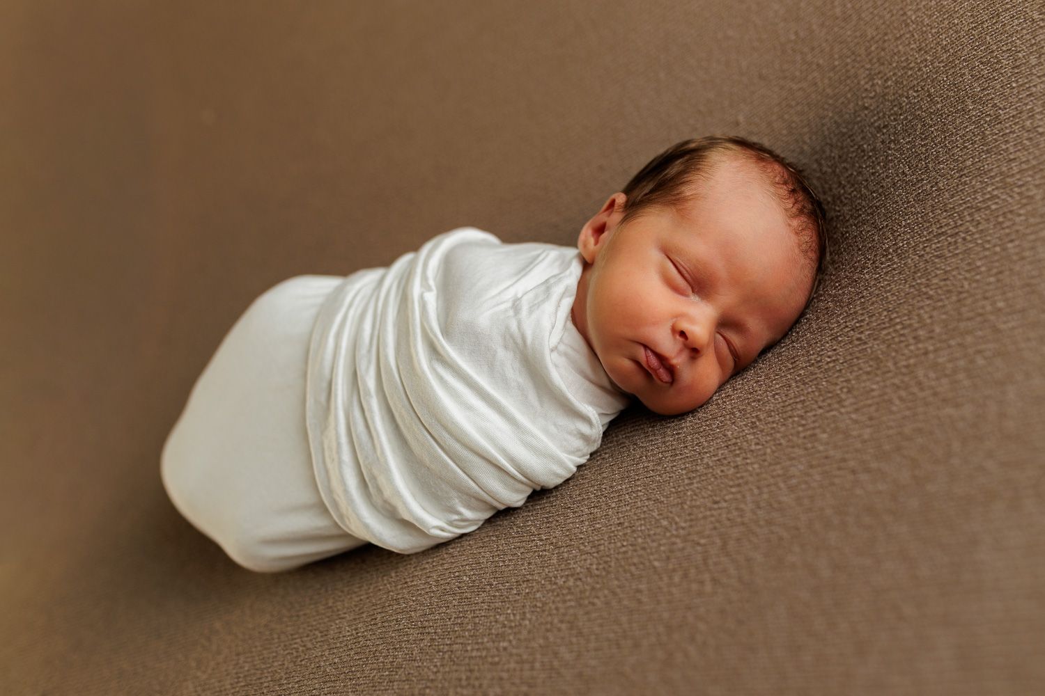 Newborn photography baby boy swaddled