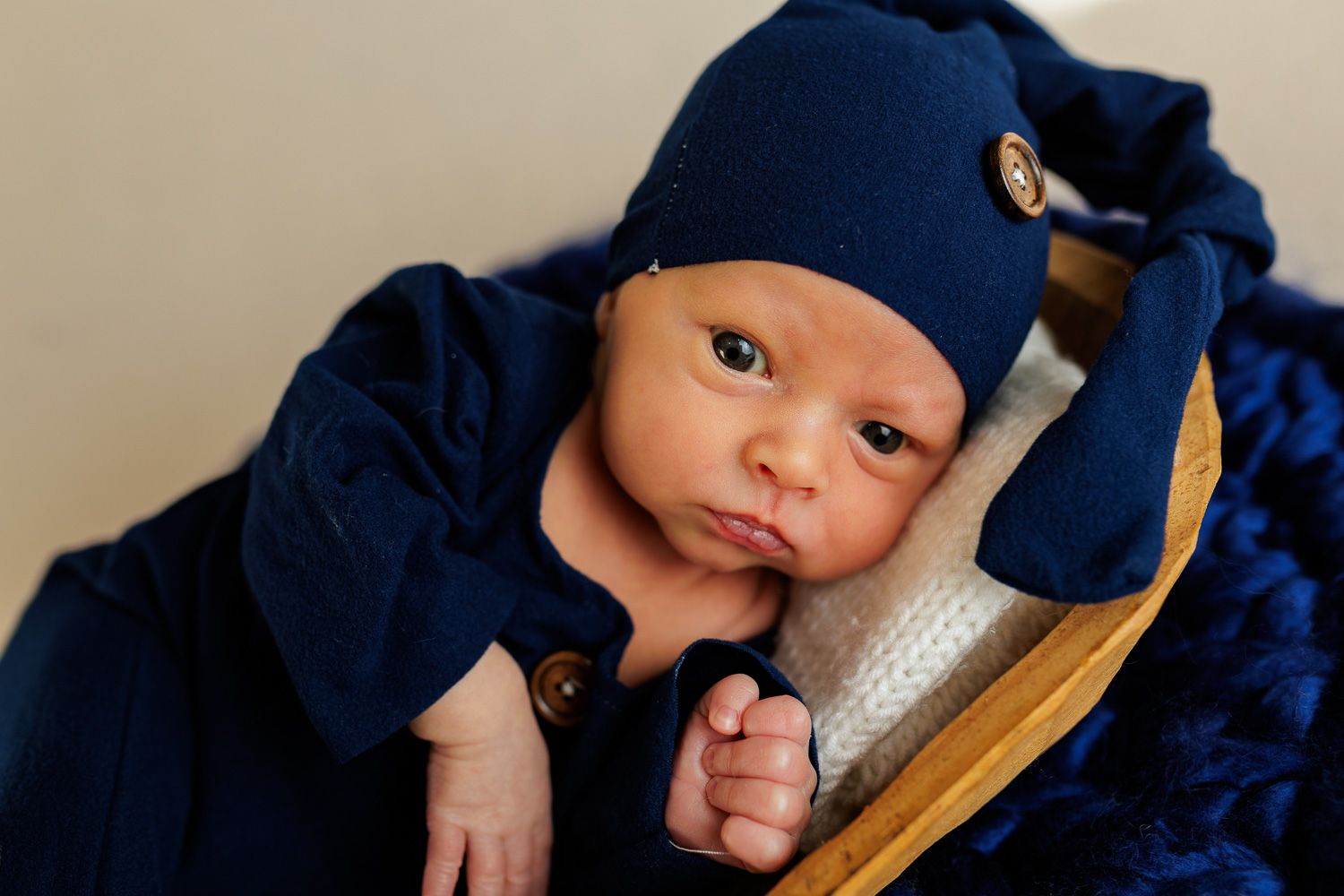 Newborn photography baby boy in blue pajama set